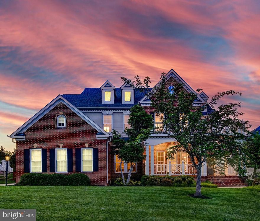 Perched atop a scenic hill in the heart of Broadlands, this impressive residence offers over 7,000 square feet of beautifully finished living space, with five spacious bedrooms, five full and one half bathrooms, and a flexible layout ideal for modern living. 

At the heart of the home, the gourmet kitchen is a true centerpiece—boasting a dramatic waterfall island, new high-end quartz countertops with a full-height backsplash and a waterfall edge on one side, and designer finishes that blend style with functionality. New pendant lighting adds a modern touch, while top-of-the-line appliances include a brand-new cooktop and ventilation fan, with the dishwasher and refrigerator also less than a year old. Whether you're preparing a weeknight meal or entertaining a crowd, the spacious layout offers ample room for cooking, casual dining, and seamless connection to the surrounding living spaces.

The main level is designed to impress and function with ease, featuring rich hardwood flooring, a sun-drenched morning room, a dramatic two-story family room, and a formal dining room perfect for entertaining. A separate living room with a cozy fireplace and custom built-ins adds warmth and character, while the private home office provides a quiet, dedicated workspace. A three-car side-load garage with a flat driveway offers plenty of room for vehicles, storage, and everyday convenience.

Upstairs, you’ll find generously sized bedrooms, including an expansive primary suite that serves as a luxurious retreat. This impressive space features a grand sitting room, a spa-inspired bathroom with elegant finishes, and a private terrace offering sweeping views—perfect for peaceful mornings or unwinding at the end of the day.

The finished walk-out basement expands the living and entertaining options, offering a spacious recreation room, a stylish wet bar with unique architectural detailing, a fireplace, and a beverage center with dual fridges. It’s the perfect space for game nights, movie marathons, or hosting guests.

Step outside to an entertainer’s paradise, where the thoughtfully designed outdoor living space invites relaxation and gathering. The expansive patio is anchored by a built-in BBQ area, perfect for grilling and alfresco dining, protected by  the charming gazebo offering a shaded retreat. As the sun sets, the outdoor fireplace becomes the centerpiece—casting a warm glow and creating a cozy atmosphere ideal for evening entertaining. Whether hosting summer cookouts or enjoying peaceful nights under the stars, this beautifully appointed space is a true extension of the home’s comfort and style.

Located in the sought-after Broadlands community, residents enjoy access to scenic trails, three pools, tennis and pickleball courts, a soon-to-open rec center, and proximity to Clyde’s and some of the nation’s top-rated schools. This home truly delivers exceptional comfort, space, and style in one of Northern Virginia’s premier neighborhoods.