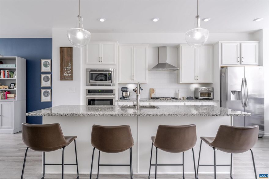 Tucked into Spring Hill Village, an inviting neighborhood with easy access to Charlottesville amenities, this townhome features one of the community?s most sought-after floor plans. With both front and rear parking, plus a 2-car garage, the home is entirely above ground, allowing natural light to fill every room. The entry level offers a convenient half bath and a versatile flex room ideal for a home office or study. The main level showcases a bright, open layout with a generous living room, dining area, and a well-appointed kitchen featuring a wall oven and microwave, gas cooktop, and dishwasher. Upstairs, the primary suite includes a walk-in closet, accompanied by two additional bedrooms, a full bath, and a full-width laundry room with a side-by-side washer and dryer. Additional storage is available in the attic, accessible by a pull-down ladder.,Granite Counter,Wood Cabinets