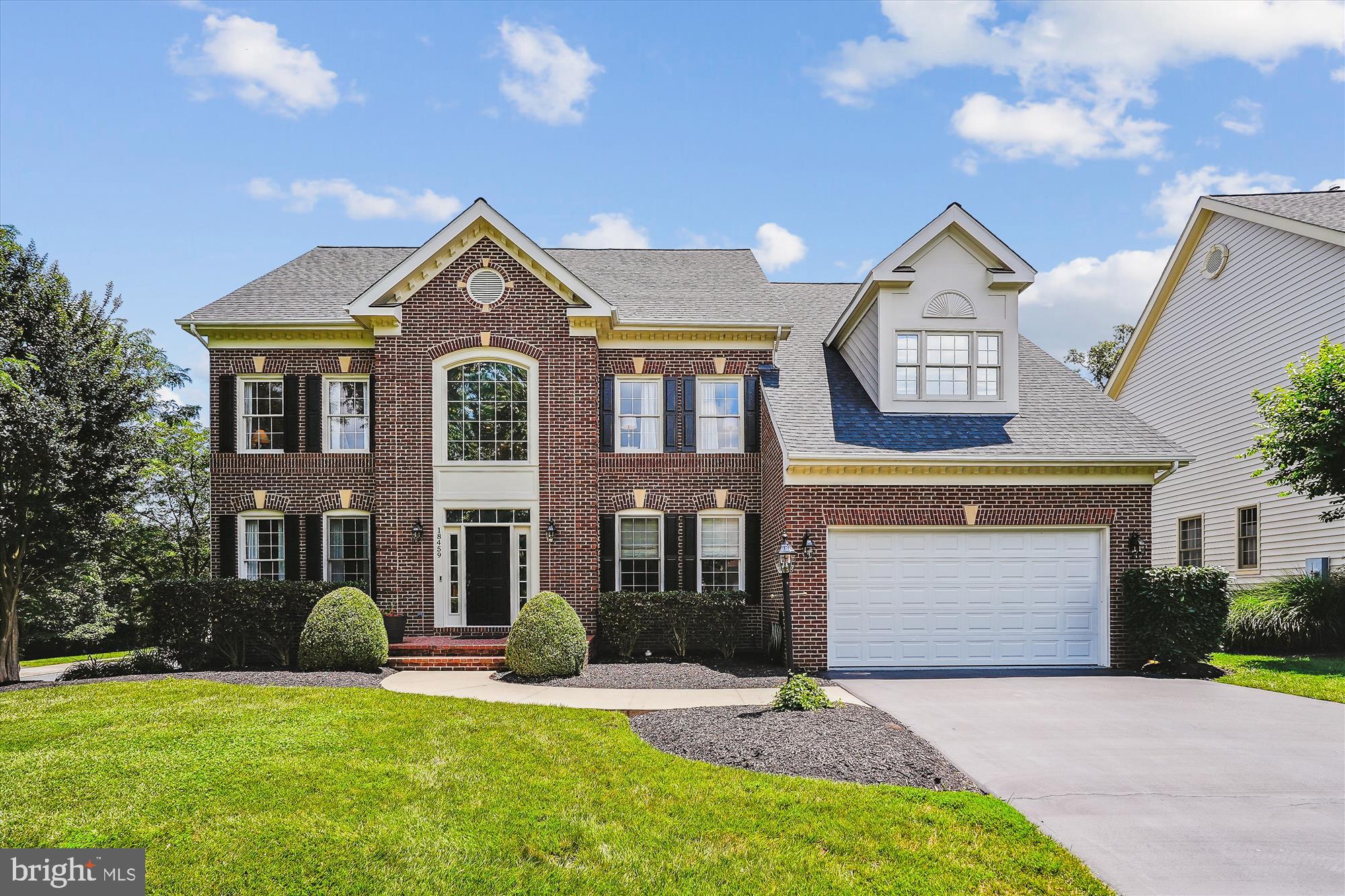 This Northlake home has a fantastic open floor plan that will have you loving every room in this house. The front entrance is picture-perfect for welcoming family and friends; a large two-story foyer is complemented with a graceful sweeping staircase, and an open formal dining area ensures a smooth flow for all your gatherings, especially during the holidays.
A private office with glass French doors tucked away around the corner, and a two-story Great Room with an entire wall of nature-inspired windows, remote-controlled shades, as well as a two-sided gas fireplace shared with the adjoining sunroom, which has lots of windows and beautiful seasonal views of mature trees and professional landscaping.
If you’re a foodie, you’ll love cooking in this gourmet kitchen with its stainless appliances, gorgeous granite counters, built-in cubbies, and a walk-in pantry with easy access to essentials. It’s everyone’s favorite go-to spot.
The Beautiful, wide plank hardwood flooring throughout the main level lends a modern, upscale feel to the house. A private back staircase from the kitchen to the upper level features new neutral designer carpeting and large bedrooms. The primary suite offers a spacious sitting area with private deck access, ideal for your morning coffee, two walk-in closets, a large ensuite bath with a soaking tub, separate shower, private water closet, wall sconces, double vanities with matching etageres.
The fully finished, lower level is a great place to unwind. It walks out to the sprawling covered patio as well as the manicured grounds. It has two large, versatile rooms with full-size windows, closets, a full bath, a built-in wet bar, a game area, and is outfitted with a second laundry connection. Its current use is a media room and second home office, but it can easily be a sophisticated multi-generational, in-law, or au pair living suite, lots of possibilities. The pride of ownership shines throughout, and you can tell that the current owners have loved this home, freshly painted, new designer flooring, energy-efficient LED lighting, water heater, washer and dryer, and a new 25-year architectural roof installed in 2024.
The backyard is a true oasis, with a park-like setting, and prime corner location, fully fenced with mature trees for total privacy, backing to a common area with a bubbling brook. Over $300,000 in outdoor amenities, including a custom wrought iron spiral staircase leading to the upper-level deck which spans the length of the home, a multitude of open and covered patios with a fire pit, stone walls, outdoor cooking area, including a cozy screened gazebo, ideal for romantic evenings, along with a brand-new Sunbrella black-and-white striped awning (updated shortly) So, regardless of the weather, you can enjoy the great outdoors every day of the year. There is an in-ground irrigation system that makes watering a breeze in the front and side yards. Plus, the landscaped beds are so big and beautiful, they’ll be the envy of all your friends and neighbors!
Community amenities at Lakes of Red Rock include a 5-acre lake with lots of walking trails and a covered bridge, two playgrounds, a six-lane pool with zero-entry and wading pool, and two lighted tennis and basketball courts. This community is adjacent to the scenic Red Rock Overlook Regional Park, next to the Potomac River. Conveniently located off River Creek Parkway for easy access to everything you desire, major shopping, and upscale dining,