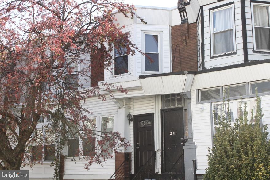 Come take a look at this stunning, fully renovated two-story home in West Philadelphia, conveniently located just off Baltimore Ave. As you approach the property, you'll be greeted by a charming fenced-in front yard, perfect for gardening and adding your personal touch to the curb appeal. Step inside and you'll immediately be captivated by the enclosed porch, offering both privacy and an abundance of natural light. The spacious living room boasts exposed brick walls, an open floor plan, modern metal railings, and beautiful hardwood floors. The kitchen has been fully updated and features sleek white colored cabinets, a center island, stainless steel appliances, granite countertops, and a sleek subway tile backsplash. Moving towards the rear of the home, you'll find a fully cemented backyard, providing shade and privacy for outdoor enjoyment. The finished basement offers high ceilings, porcelain tile flooring, a generously sized half bath, and ample storage space. Don't miss out on the opportunity to make this your dream home.