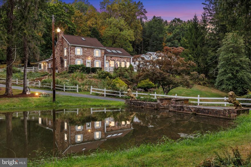 Step into a rare piece of history with this stunning property.  As you arrive, the first thing you see is a large, tranquil pond that gracefully greets you, setting the tone for the serenity and beauty to come. This rare estate masterfully blends a circa 1856 brown stone farmhouse with expansive modern updates, creating a harmonious balance of historic character and contemporary comfort.


Originally built in 1856, the home was thoughtfully transformed around 2005 with major additions, resulting in a residence that perfectly combines old-world craftsmanship with today's amenities. The expansive great room, featuring soaring ceilings and an abundance of natural light, is truly breathtaking—an ideal space for both gatherings and quiet moments.

The estate spans over 10 acres of lush, versatile land that can be enrolled in the “Clean and Green” program, offering potential tax advantages and the flexibility to create your agricultural or recreational haven. Beyond the home, you'll find a charming barn, garage, and stables—perfect for horses, livestock, or hobby farming.


Surrounding the home, enjoy the scenic beauty of the woods, an open field, and the peaceful mountain brook that runs along the front of the property. The outdoor space is complete with a sparkling inground pool, perfect for relaxing, swimming, or entertaining during warm summer days.  The land offers countless possibilities—whether you want a private retreat, a small farm, or simply a sprawling estate to relax and enjoy nature.


The residence includes four spacious bedrooms and 3 full bathrooms, featuring updates that blend seamlessly with its historic roots—original pine floors, modern bathrooms, and a luxurious master suite with vaulted ceilings, a walk-in closet, and marble bath. The kitchen’s standout features include granite counters, stainless steel appliances, and custom granite tables and desks, all magazine-worthy.


Additional highlights include a study, a partial basement, and outdoor living spaces with a deck overlooking the serene pond and expansive field—perfect for outdoor entertaining or quiet reflection.

Located just minutes from town and major highways, this estate offers a peaceful, rural retreat with easy access to urban amenities. Experience the charm of a historic farm combined with modern upgrades—an extraordinary opportunity to own a private oasis where history, nature, and elegance converge.


Schedule your private tour today and discover your dream estate in the making.