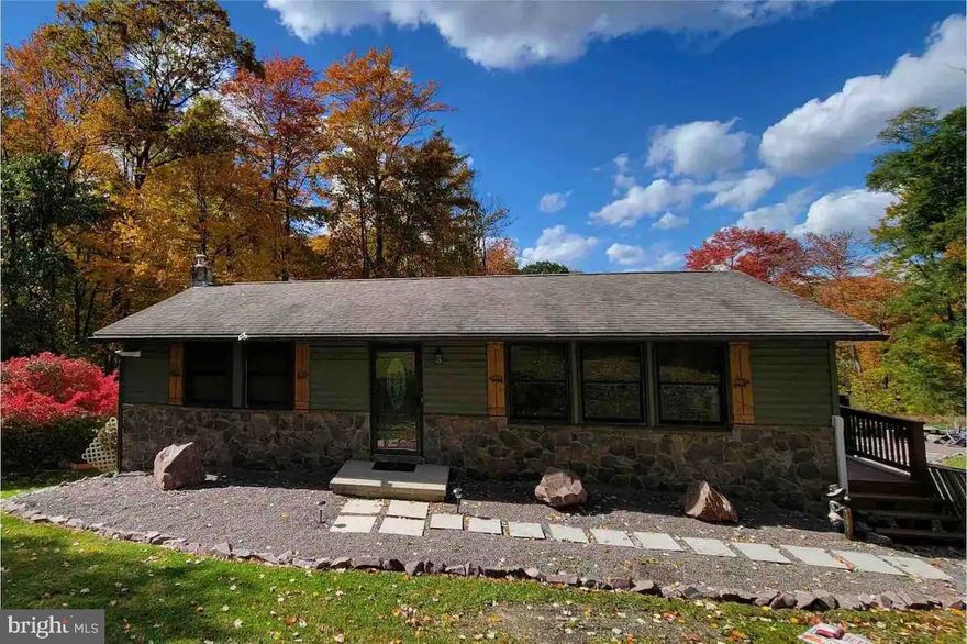 Extremely cozy, rustic vacation home located close to Wisp ski resort! Situated on a private, oversized 2.82 acre lot and completely remodeled/updated throughout. Featuring a newer kitchen with stainless steel appliances, updated bathrooms, newer flooring, stone fireplace, all new mountain style decor, and a lower level rec room.  The exterior has a large deck, covered hot tub, and a newer fire pit with speakers that is great for gatherings with family and friends. Just a few minute drive to the Wisp ski resort entrance and all other Deep Creek Lake restaurants, shops, and marinas! Excellent self-manager vacation rental thru AirBnB with a strong history of $60,000 in 2023!