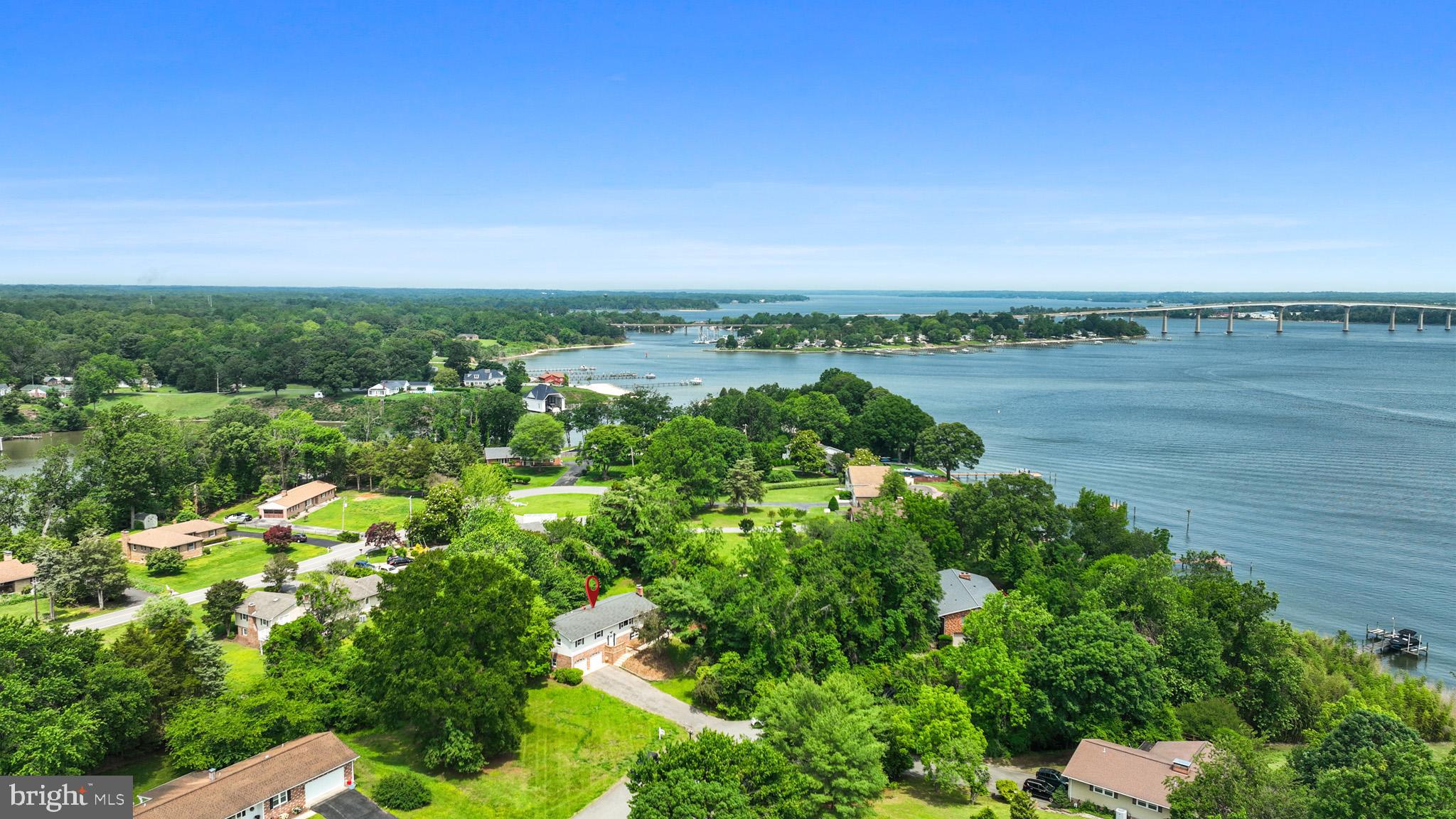 Welcome home to this super spacious, move in ready home with beautiful WATER VIEWS! As you enter, you will love the open concept feel on the main level with the kitchen, dining room, and TWO spacious living rooms, one featuring a beautiful fireplace. Off of the second living room, you can enjoy the absolutely stunning water views of the Patuxent River on your back deck. This floor also features 3 spacious bedrooms and 2 full bathrooms. The primary suite features a spacious walk in closet. As you head downstairs, you will love the large, completely renovated, entertainment area featuring a wood stove. This floor also has a bedroom and a half bathroom. The oversized 2 car garage is sure to fit all of your storage and car needs! There is a private waterfront access for Esperanza farms residents at the end of Green Holly Road. You can fish, launch a kayak/paddleboard, etc! This home is conveniently located close to NAS Pax River, many restaurants, shopping, parks, and more!
