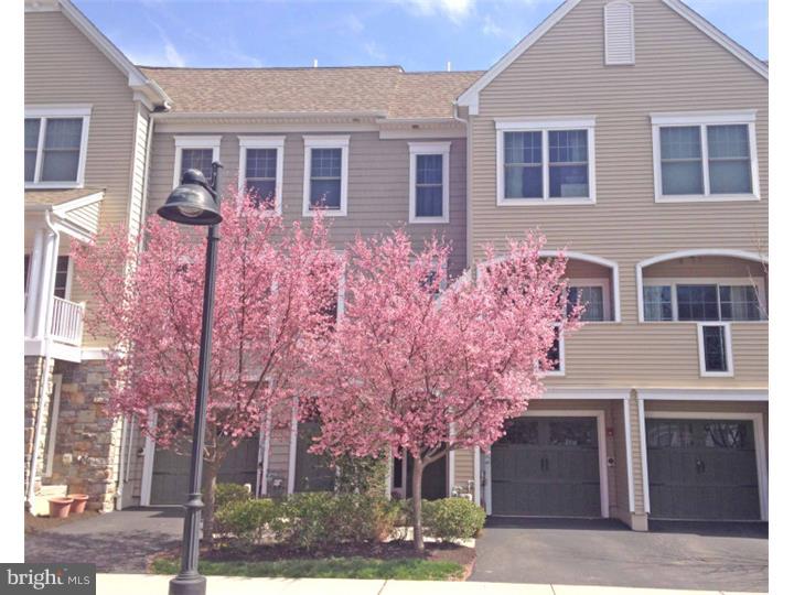 Four levels of luxury living in a very young townhouse in Lower Merion School District! Entering this home you are greeted with an open foyer which leads to a spacious Family Room with sliding doors to the back patio and a manicured common area lawn space. The Laundry Room, with a new washer, is also on this level, as well as access to the 1 car attached garage and plenty of storage. Going to the main level, you are in a very open floor plan which includes the dining and living areas. The gleaming hardwood floors accent the neutral colors and both rooms have beautiful crown molding adorning the 9 ft ceilings. There is a ton of natural light from the front, oversized windows and the access to the front porch, a great place to relax at the end of the day. The Kitchen with its Breakfast Room has plenty of cabinets, granite counter tops, high end stainless steel appliances and hardwood floors. You also have plenty of light coming from the windows and the sliding door that gives you access to the nice sized deck overlooking the rear area, a great place to enjoy a Summer dinner. Topping off the main level is a Powder Room. The Master Bedroom is very spacious and has a huge Walk In closet and a full Bathroom with double sinks and spacious shower area. The second Bedroom on this level is a nice size with a large closet. Finally, there is a roomy hall Bath. The next level up is an oversized Bedroom. Depending upon your needs it could be a second Family Room, an office or play area. Enjoy living in this community where the association takes care of all outside maintenance, gardening and snow removal.  There is parking for another car in the driveway and there is visitor parking right outside your door. All of the appliances and the heating and air conditioning systems are energy efficient as are all of the windows. You are a short walk to Suburban Square and have easy access to public transportation, shopping and major highways.  You're going to want to see this one!
