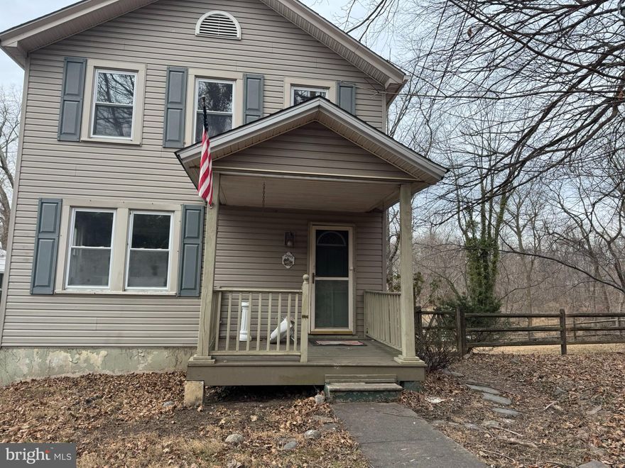 This charming Colonial-style home, built in 1922, offers a unique investment opportunity with significant potential for appreciation. The property features 3 bedrooms and 2.5 bathrooms, with a traditional floor plan that includes a galley kitchen and a cozy living area with a fireplace. The interior requires major rehab, allowing investors to customize and increase value. Set on a 0.11-acre corner lot, the exterior boasts a partly wooded yard that backs to trees, providing a serene backdrop and enhancing privacy. The property includes an asphalt driveway with space for three vehicles, ensuring ample parking. Enjoy scenic views of the creek and surrounding woods, perfect for nature enthusiasts. The location in a cul-de-sac adds to the appeal, making it attractive for future tenants or buyers. With a focus on renovation, this property presents a promising opportunity for investors looking to capitalize on the growing market.