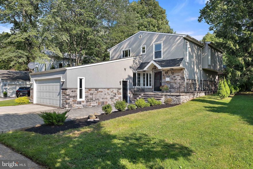 Located in a picturesque setting along the tree lined streets of Wynnewood, this 5 bedroom 2.5 bath home has been recently renovated. Cross over the babbling brook to the front of the home with a large 2 car garage. Nicely appointed paver walkway up to the front porch. The main level features hardwood floors, fresh neutral paint, and beautiful light fixtures throughout. The living room has a wood burning fireplace, an office or playroom adjacent, and recessed lights. The formal dining room leads into the kitchen featuring new cabinets, counters, flooring, and light fixtures. The laundry room is conveniently located next to the kitchen. The main level offers an additional family room with a large bay window to the rear patio and brand new powder room complete the main level. Upstairs you'll find 5 bedrooms, all with hardwood floors, recessed lights, closet organizers, and bright windows giving plenty of natural light. The hall bathroom has a new vanity. The primary bedroom features a walk in closet, private balcony, and master suite with shower. Walking distance to the award winning Penn Wynne Elementary school. This Main Line home gives you a charming community with a newer home feel. Updated systems throughout. Make your appointment to see this beautiful home!