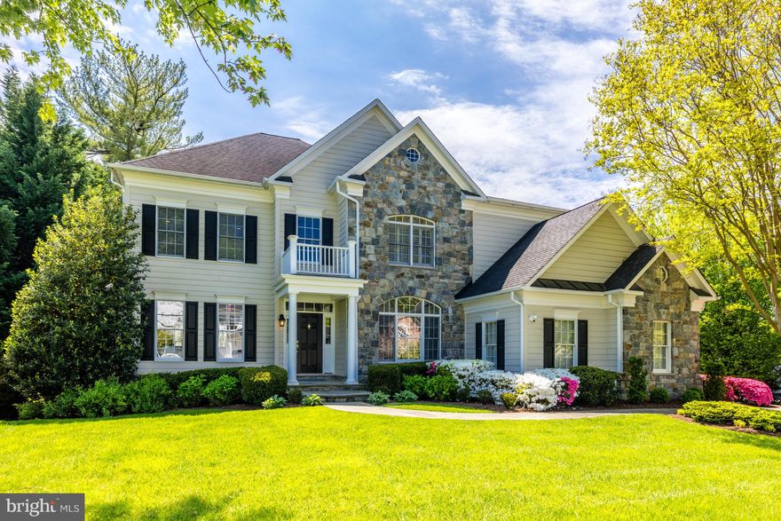 This picturesque residence, with a stone front, is nestled on a lushly landscaped lot in the sought-after Salona Village. Boasting 5,500 sq ft of fully renovated living space, this stunning home is tailored to today's lifestyle. Recently renovated in 2021 by Case Design and decorated by Kristen Peake, this exquisite property offers unparalleled luxury and comfort, serving as a sanctuary for refined living in a prime location.

Step inside to discover a thoughtfully renovated interior, featuring sophisticated design elements with every detail meticulously curated using premium finishes. The two-story open foyer offers a gracious entrance, with an elegant staircase and paneled walls. Flanking the foyer are a front library with a wall of built-ins and French doors for privacy, and a light-filled formal living room that flows into the dining room, which has a paneled cove ceiling and a floor-to-ceiling bay window.

The spacious main level is ideal for both relaxing and entertaining, with a seamless flow between interior living spaces and the large outdoor deck. The gourmet kitchen is a chef's delight, equipped with top-of-the-line appliances, custom cabinetry, and an eat-up center island, perfect for culinary creations and informal gatherings. Adjacent is the breakfast nook, featuring a floor-to-ceiling bay window offering splendid vistas of the backyard.

Retreat to the luxurious owner's suite, complete with a sitting room and French doors leading to the patio. The suite includes a spa-like ensuite bath, a custom-designed closet, a coffee bar, and a gas fireplace, creating a serene oasis to unwind after a long day. The main level is completed by a mudroom/laundry room with built-ins, a coat closet, a sink, a utility closet, and a two-car garage.

On the upper level, a second family room provides additional space for relaxation, along with a second owner's suite, featuring a sitting area, a spa-like bath, and his and her walk-in closets. Three spacious secondary bedrooms (including an ensuite) and two additional baths complete this level.

The light-filled walkout lower level is finished with a spacious recreation room, featuring a fully equipped bar with a sink, a refreshment refrigerator, and a mini fridge, offering plenty of space for media and billiards. The lower level also includes a spacious exercise room, a large bedroom, and a full bath.

Located in the heart of McLean, this home offers convenient access to upscale shopping, fine dining, and premier schools. It's just minutes from the Silver Line Metro, Tysons, McLean, and major highways such as I-495, I-66, and the Dulles Toll Road, facilitating commuting to Washington D.C., Maryland, and the Dulles Tech Corridor. Experience the epitome of luxury living in this gem of a home.