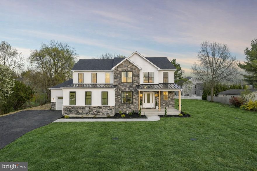 Set just minutes from Phoenixville Boro, this newly built home offers over 6,000 square feet of finished living space designed for how you actually live. It’s the rare combination of space, style, and location that’s hard to find, especially this close to everything Phoenixville has to offer.

From the moment you step inside, the scale and natural light stand out. Ten-foot ceilings, clean modern finishes, and a thoughtful layout create a home that feels both elevated and comfortable. The main living areas flow seamlessly, making everyday living easy and entertaining even better.

The kitchen is truly the heart of the home, anchored by an oversized island and surrounded by stylish cabinetry, a commercial-grade six-burner range with double oven, and a custom Calcutta quartz surface. The scullery adds a level of convenience that sets this home apart, complete with additional storage, a sink, and a second dishwasher.

Just beyond, the kitchen opens into a stunning morning room with a cathedral ceiling and wood beams, and into the family room with a floor-to-ceiling fireplace and direct access to the covered deck. This indoor-outdoor flow is where the home really shines.

The main level also includes a full bedroom and bath, ideal for guests or flexible living, along with a private office and a well-designed mudroom.

Outside, the covered composite deck with a gas fireplace creates a true extension of the home. The level yard offers plenty of space for a future pool, play, or outdoor entertaining.

Upstairs, the primary suite feels like a retreat, with two oversized walk-in closets and a spa-like bathroom featuring a freestanding soaking tub, oversized tile, and a walk-in shower with a vertical spa feature. Additional bedrooms are generously sized, including a Jack and Jill layout and a private en-suite, plus a bright loft and second-floor laundry.

The finished lower level adds even more flexibility, with a bar with leathered black counters, space for a gym, an oversized full bath, and accent walls with a fireplace.

With over 6,000 square feet of finished space, this home offers the kind of layout, design, and functionality that’s hard to replicate. And just minutes from Phoenixville’s restaurants, shops, and trails, with easy access to Route 422, SEI, and GSK, you get both space and convenience in one location.
