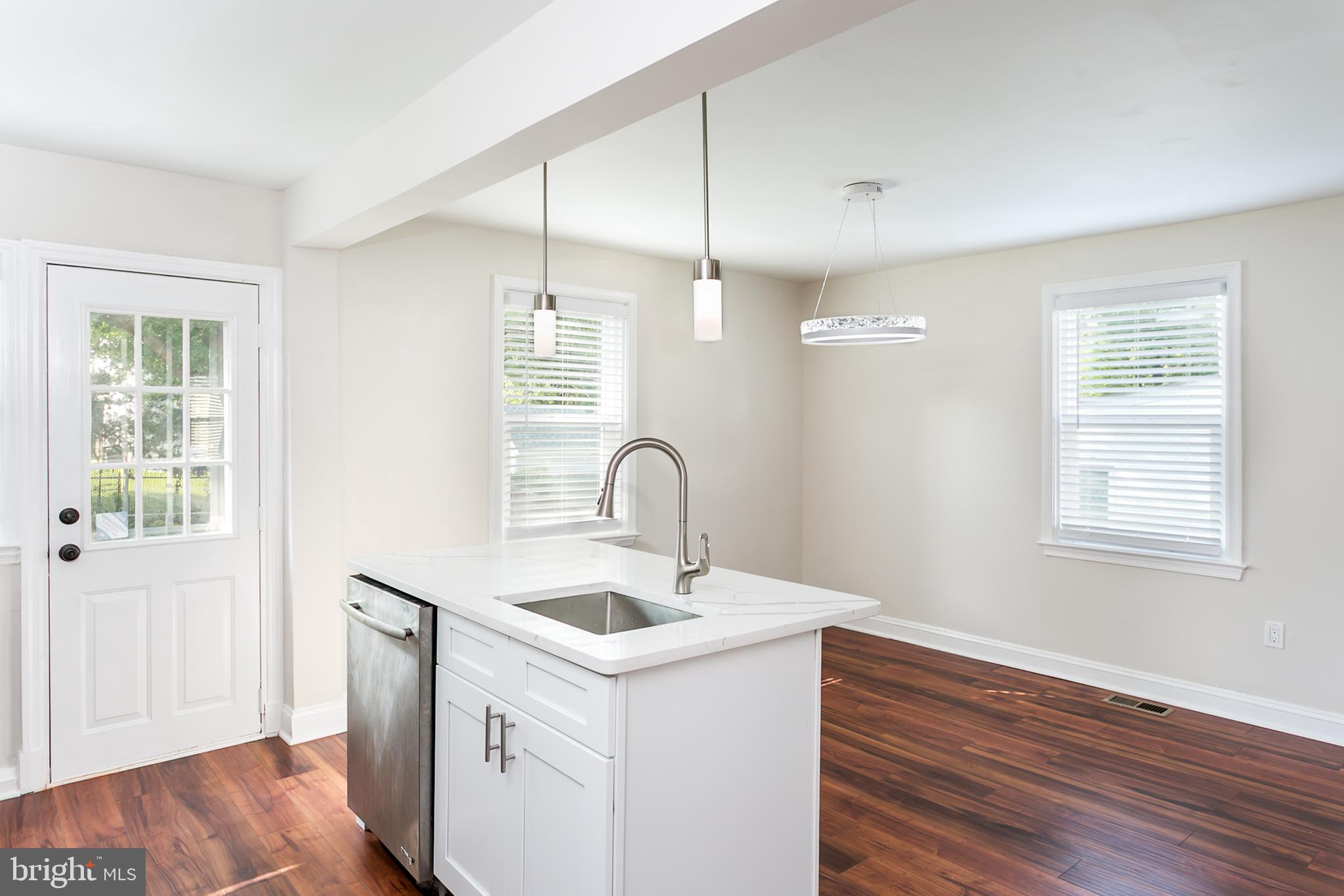 Visit this fresh and clean move-in ready home with all the amenities bathed in tons of natural light and sporting a large fenced backyard. The appliances are all new as well as the A/C. The floors are fresh throughout. These floors shine. The colors are modern & neutral. There is a beautiful full bath with a huge shower on the main floor and an all new full bath with a tub on the 2nd floor- no running to the basement to find an extra bathroom. When you visit the basement you will find a clean space with industrial floor paint and the washer and dryer and natural light and plenty of space for storage and also an exterior exit from the basement to the yard. Bring your style to this home because it has a fresh , clean palette to work with. The lighting fixtures will be the envy of your family and friends. Bring your green thumb and continue the garden out front and create a gardening and gathering paradise in the fenced back yard.