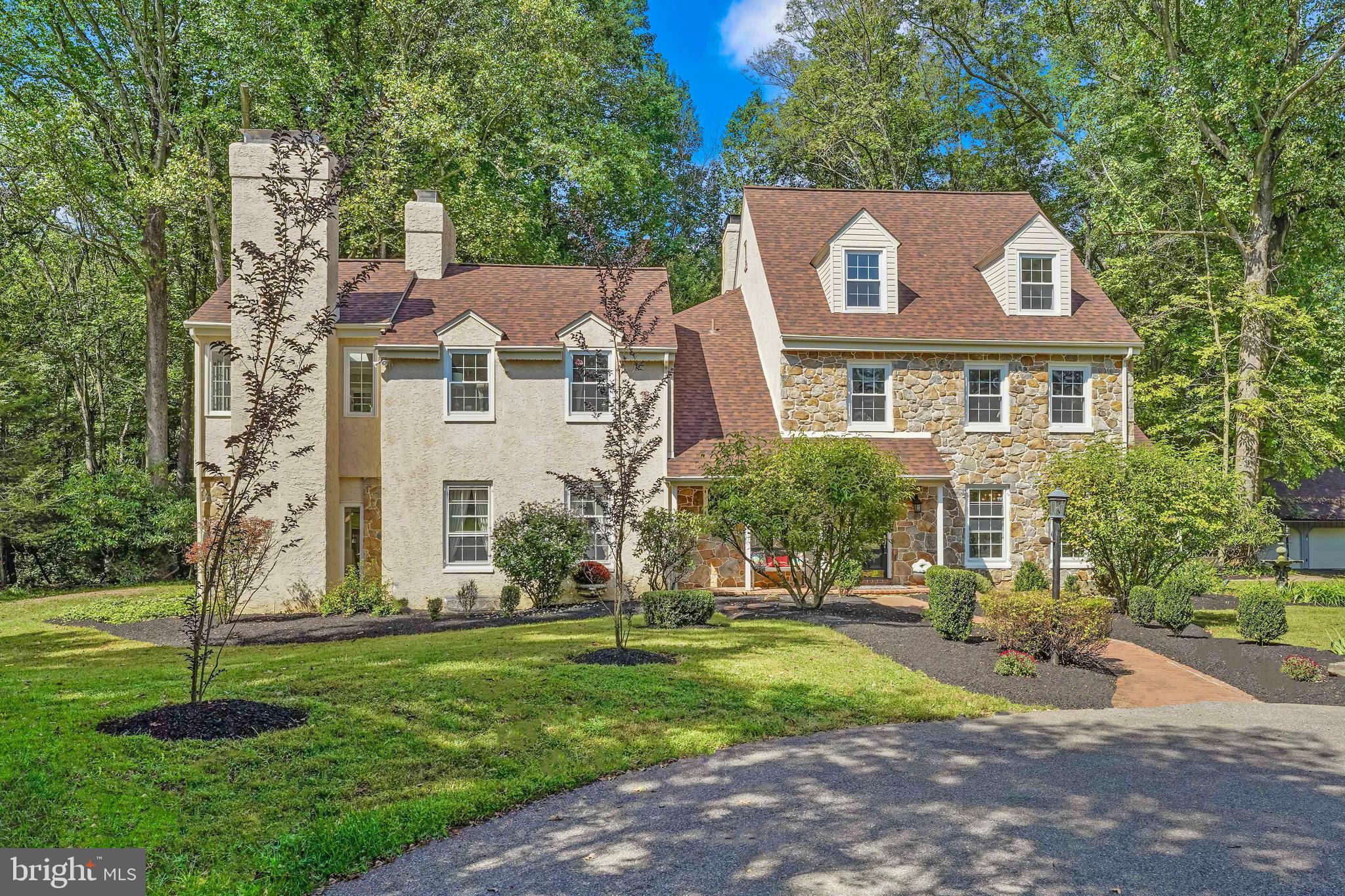Rarely does a truly unique, estate property like this one become available. Situated on 16.6 acres in Chadds Ford this property includes open fields, woods and a stream. Located in the AWARD WINNING Unionville-Chadds Ford School District, ranked top 2% in the nation by US News & World Report, this property is adjacent to horse farms, convenient to Route 1, and a short drive to Philadelphia, Wilmington and Maryland. The estate consists of the main residence, a detached two car garage, a TENNIS COURT and a beautiful IN-GROUND POOL complete with an adjacent pool house which has a second kitchen, a full bathroom and shed storage for outdoor equipment or a work/hobby space. The long driveway offers pastoral views as you approach the elegant 3 story home complete with a circular driveway entrance, brick paver walkway, manicured landscaping, and a welcoming front porch. This home offers gorgeous hardwood floors throughout, custom moldings, and beautiful built-ins which are just a taste of the quality and attention to detail you will find in this splendid residence. To the right of the main entry is the formal dining room with a breathtaking bay window that frames the nature and water fountain just outside and a large wall of built-ins which make the perfect place to store all the crystal and fine china and entertaining accoutrement. To the left of the main entry is the half bath and office/library. The center hall also opens to a gracious formal sunken living room with a gorgeous fireplace, built-in bookshelves and cabinets, and a corner cabinet wet bar. French doors lead to the sunroom with a brick floor and walls of windows which allow the outdoors in. The back of the house has the cozy family room complete with a large wood burning fireplace, built-ins and an exposed wood beam that adds to the charm and character of the space. The adjacent Chef’s Dream Kitchen is both stylish, spacious, and functional. The countertops are real quartz, the backsplash is a beautiful marble mosaic, the island in the kitchen is almost an entire slab of stone with plenty of space for the cooktop, seating around the island, storage, and meal prep. Within the kitchen, there is a built-in desk, pantry storage, and an area for the kitchen table overlooking the attached, screened in porch. The screened in porch and deck just beyond provide the perfect place for outdoor dining and enjoyment of this magnificent property. The second floor offers generously wide hallways. The spacious master suite includes a huge, walk-in closet, French doors that lead to a large sitting room with fabulous views of the countryside and complete with fireplace and a whole wall of windows and separate outside entrance, plus a lovely master bathroom with a custom marble shower, two vanities, and a separate toilet room. The remainder of the floor consists of a cedar closet, laundry room, full bathroom, and three additional bedrooms (one of which is being used as a workout room). The third floor would be an ideal space for a live-in nanny-suite or separate living quarters; it consists of two bedrooms and a full bathroom. The finished basement provides for a wonderful entertaining and recreation space. From the game room with classic wainscotting and built-in wet bar, to the second office area, to the sunken additional family room space and half bath, this level has it all. Stucco has been inspected and repairs completed. HVAC new in 2022. Estate properties of this caliber in highly sought-after, top-rated school districts rarely become available. This is truly an exceptional property that you and generations of your family would be proud to call home.