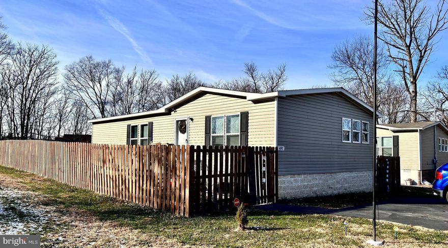 Come and enjoy this fantastic doublewide mobile home on unrestricted lot that is off the main road, but close to shopping, schools, entertainment venues, and restaurants.  Only two minutes from I-81, this home features 3 BR and 2 full baths.  You will love the open layout of the living room/kitchen/dining with awesome natural light throughout.  The kitchen is a chefs dream, with lots of counterspace and cabinetry.  The large island provides a great entertainment area, as there is room for stools for simple meals, or just having a conversation over a cup of coffee.  The bedrooms are all reasonably sized with decent closets.  Primary bath features a double standup shower and double vanity.  The yard is fantastic and private with wooden privacy fence encompassing most of the property to keep your children (including the furry ones) within the confinds of the property.  The large shed at the rear of the property offers lots of storage for tools, yard equipment, or you could make it a keen workshop.  Are you ready to take a look?  Call today to schedule your appointment!