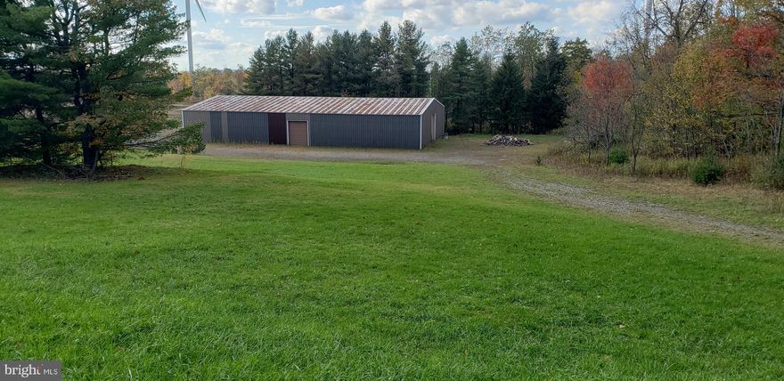 Beautiful Garrett County, 5.82 acres with large steel warehouse, community maintained road.