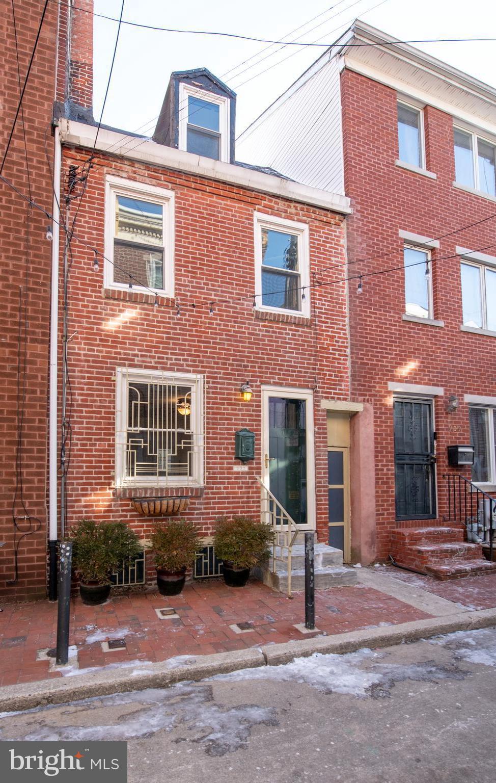 PRICED TO SELL QUICKLY! NEW PRICE-Reduced Drastically for a Clean and Quick Sale! Nicely Updated 2 Bedroom, 1.5 Bath Home That Beautifully Blends Traditional Trinity Character with Modern Touches! Entry into Living Room w/Original Hardwood Floor, Brick-Wood Burning Fireplace, Well-Designed Kitchen w/Butcher Block Countertops, Plenty of Cabinetry, Stainless Steel Appliances, Garbage Disposal, Dishwasher and Exit to Newer Rear Deck with Grill. 2nd Floor Offers a Spacious Bedroom with an Additional Brick-Wood Burning Fireplace & Ceiling Fan and a Gorgeous Full Bathroom Which Boasts a Double Shower with Glass Doors, Claw Foot- Stand Alone Tub Against Brick Accent Wall, Pedestal Sink & Natural Sunlight. 3rd Floor Offers a 2nd Bedroom or Office with Original Hardwood Floor and Sliding Glass Doors Leading to Outdoor Roof Space Overlooking the City. Basement Level Offers BRAND NEW Powder Room, Laundry Area & Ample Storage. Additional Features Include: 2 Updated Mini Split Air Conditioning and Heaters w/Warranty & Maintenance Contract, Beautiful Hardwood Floors, Stunning Remodeled Bathroom, 2 Outdoor Spaces, Newer Hot Water Heater with New Piping & Flood Stop & So Much More! This Home is Conveniently Located Near Many Queen Village Favorites as Well as Close to Schools, Shopping, Restaurants and Transportation- Just Minutes From Major Roadways and Bridges! You Won't Want to Miss This Home, Schedule Your Tour Today!