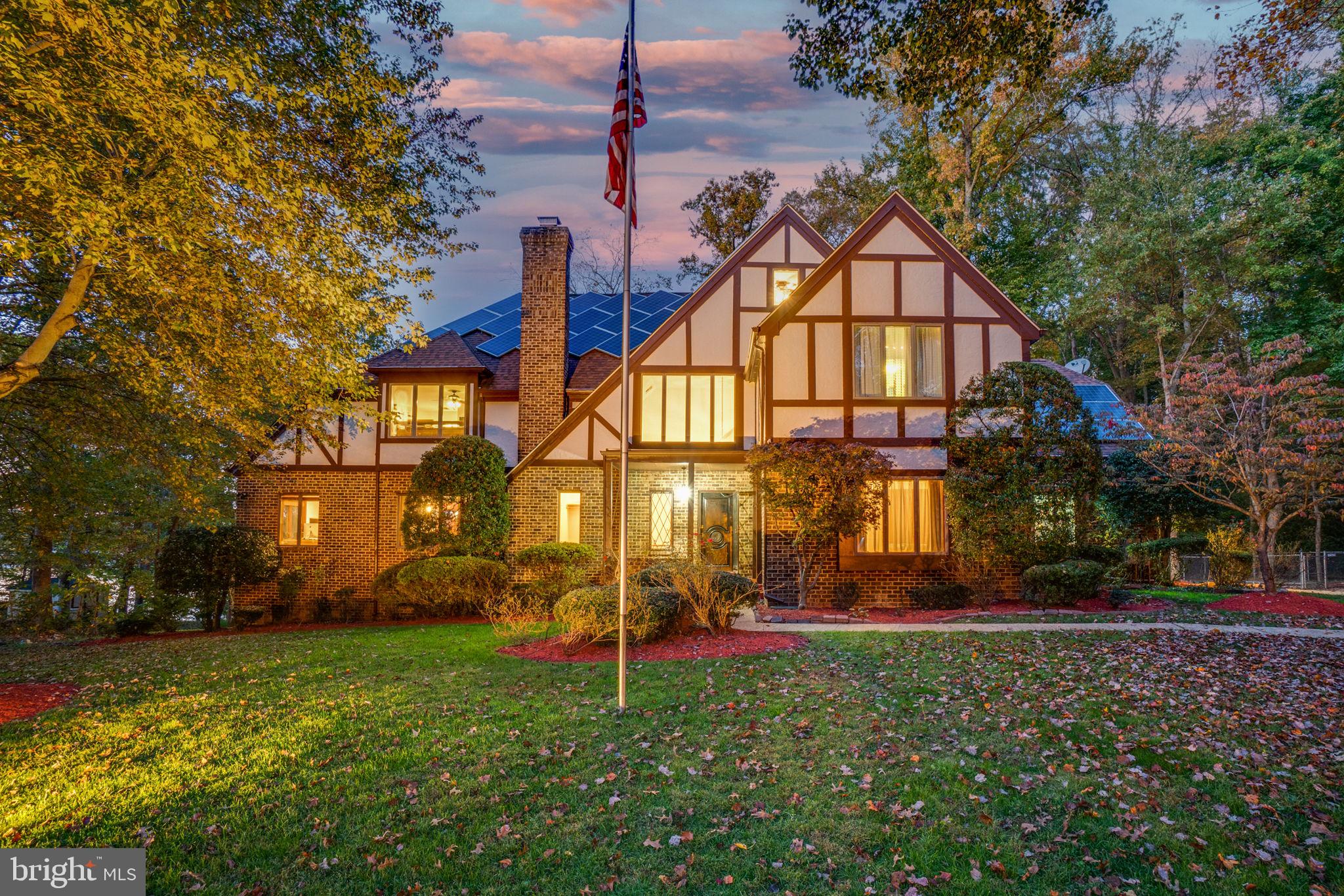 A Tudor Treasure on the Water: Grand Living Meets Natural Serenity
Welcome to a truly exceptional waterfront residence where timeless English Tudor elegance meets modern luxury and breathtaking natural beauty. This stately 6-bedroom, 5.5-bath estate unfolds across four expansive levels, offering almost 7,000 sq ft of inspired living space—perfectly designed for elegant entertaining, multi-generational living, and tranquil privacy.
From the moment you arrive, you’ll sense something special. The curated landscaping frames this majestic home with style and grace. Atop the architectural shingle roof, 39 fully purchased and discreetly placed solar panels offer energy efficiency without compromising classic charm.
Inside, every level offers a thoughtfully designed experience. The main entrance welcomes you with a soaring two-story mahogany foyer, leading into a dramatic great room with a wood-burning brick fireplace and commanding water views. Enjoy cinema-style evenings with the 80-inch wall-mounted TV, or sip morning coffee in the sunroom, basking in the serenity of Broad Creek.
The remodeled chef’s kitchen boasts granite counters, upgraded appliances, and a delightful breakfast nook that opens to the upper deck—perfect for al fresco dining. Entertain in style in the Italian-inspired formal dining room, or relax in the music and memory room, featuring a gas fireplace and adjoining study.
Upstairs, the grand primary suite offers his-and-hers walk-in closets and private dual bathrooms—hers with a jacuzzi tub and a glass shower—creating a luxurious personal retreat. The additional freshly painted and carpeted bedrooms include a vaulted sea-to-sky themed suite, ideal for a young dreamer.
The top floor includes a newly updated guest suite and a massive bonus room, already framed and ducted, ready for your vision. Meanwhile, the lower level redefines recreation and offers a blank canvas for all lifestyle requirements.
Step outside to a sanctuary of leisure and awe: multi-tiered decks, a waterfall jacuzzi, a paver patio, and a 100-foot L-shaped dock for kayaking and water sports. An Amish-built treehouse, swing set, and playland await discovery. EV-ready garage, seven-zone sprinkler system, and over 200 acres of preserved federal wetlands as your backdrop—this is not just a home, but a legacy. A rare offering of nature’s masterpiece paired with refined living.
Your waterfront dream begins here.