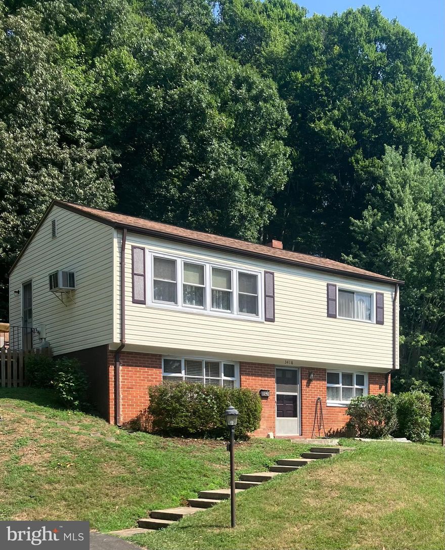 Nice 4 bedroom home on huge wooded fenced lot.  Sold "as is" and could use some updating in the kitchen and painting thru-out.  Wall window unit a/c keeps the house cool during the warm weather.  Hardwood floors on upper level.  New hot water heater and boiler system.  Roof is approx. 5 years old.  Huge 16x12 deck off kitchen.  12x20 shed with work bench