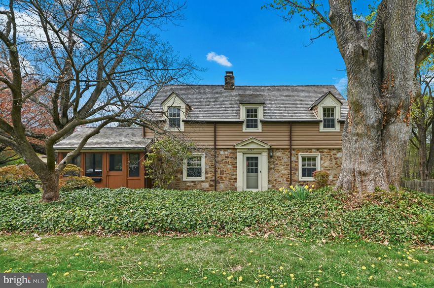 Charm and character define this solid stone Colonial, built in 1935 and nestled on a picturesque tree-lined street in the highly sought-after Coleston neighborhood, also known as Grand View Heights. Lovingly maintained by the same owner for 50 years, this home beautifully blends original details with timeless appeal.

A serene walkway leads to the main entrance, where you’re welcomed by the center hall, parquet hardwood floors, deep window sills, and an exposed stone wall. The light-filled living room features a classic fireplace, parquet flooring, and access to a screened-in sunroom—perfect for morning coffee or relaxing gatherings.

The formal dining room flows into the kitchen, which is equipped with new stainless steel dishwasher, stove, oven, granite counter tops, backsplash and hardwood floor. Just beyond, you’ll find a convenient butler’s pantry and powder room. A cozy family room at the rear of the home offers a charming stone wall, built-in bookshelves, and additional storage.

Upstairs, the spacious primary suite includes a private bath and generous closet space. Three additional well-sized bedrooms complete the second floor, including a fourth bedroom with a wall of windows—ideal for a home office or art studio—along with a full hall bath.

The full basement provides a laundry area and ample storage. Additional highlights include a brand-new cedar shake roof, zoned heating and central air, fresh paint throughout, replacement windows, and new carpeting on the second floor (with original hardwood floors underneath).

Situated on a lovely corner lot with a storage shed, this home offers both charm and convenience. Property line in rear of home is marked by yellow flags. Enjoy easy access to shopping, public transportation, major highways, and a quick 30-minute commute to Center City.

This immaculate, move-in-ready home is a rare find—offering warmth, character, and a peaceful setting in a truly special neighborhood.