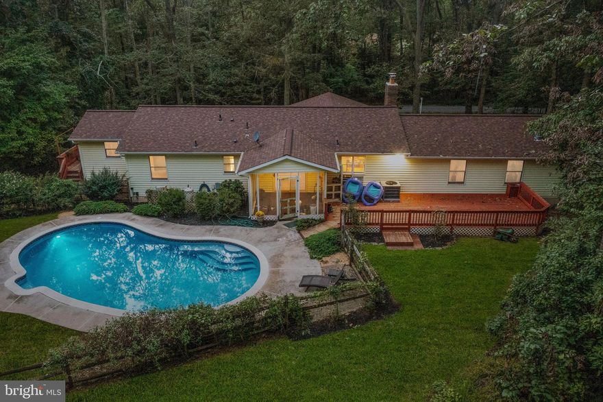 Adorable one story home backing to hundreds of acres of protected watershed nestled in the Herford Zone. Open kitchen with island and bar area.  Oversized two car garage with 11 foot ceilings. One story living with surprisingly huge primary bedroom with its own balcony which could double as an in-law suite.  Finished lower level.  Roof less than 3 years old, new hot water heater, freshly painted.  Outdoor living with immediate access to the watershed.  Cleared area perfect for gardening and hanging a hammock.  In ground pool, deck for grilling and entertaining, play area, screened in porch, and total privacy.