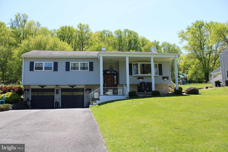 Welcome to a home that truly sets the standard for meticulous care and pride of ownership. This beautifully maintained bi‑level sits on a full, open acre in New Hanover Township within the sought‑after Boyertown School District—an unbeatable combination of space, setting, and convenience.
The main level features stranded bamboo flooring and an open, easy‑flow floor plan that today’s buyers love. The spacious living and dining rooms create a warm gathering space for everyday living or entertaining. The kitchen offers luxurious granite countertops, excellent workspace, and newer stainless steel appliances, including a built‑in microwave, dishwasher, and smooth‑top electric stove.
Down the hall, a full bath with a tub/shower combo serves the two comfortable secondary bedrooms. The primary ensuite is a bright retreat with a skylight, a beautifully tiled shower, and a generous closet.
Just off the dining area is a versatile bonus room—ideal as a guest suite, in‑law space, or private office—complete with its own full bath, large closet, and custom hardwood floors. Sunlight pours into this room, making it one of the most inviting spaces in the home.   The lower level has been finished with "fun" in mind....a corner bar for entertaining, and a coal stove to warm you on those cold winter nights, complemented with easy-care laminate flooring!    The laundry room is part of a utility area and a convenient pantry!    The two-car garage is currently being used as a craft area,  but it offers two garage door openers.  This property has been exceptionally updated and maintained, including the Roof replaced in   2014, Bathrooms renovated in 2018, Stranded Bamboo flooring installed throughout the main level, Windows, doors, and vinyl siding replaced, Central air installed in 2019, Full HVAC service completed in 2025, and upgraded 200‑amp electrical service....And to top it off, the seller is including a 1‑year AHS home warranty for added peace of mind.   This home is a true standout—beautifully cared for, thoughtfully updated, and ready for its next owner to enjoy.