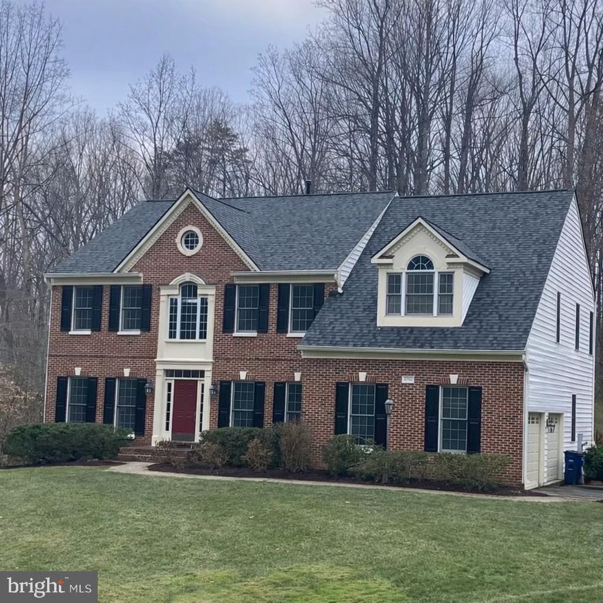 Tucked away at the end of a private cul‑de‑sac and surrounded by 5.5 acres of natural beauty, this Fairfax Station estate offers a rare blend of privacy, space, and refined living—without the restrictions of an HOA. From the moment you arrive, the property feels like a retreat, with a sweeping approach, fresh landscaping, generous parking, and a charming detached two‑car garage complete with a loft and electricity.

Inside, the home unfolds across approximately 5,760 square feet with warmth and sophistication. Hardwood floors span the main level, guiding you through a layout designed for both everyday comfort and memorable gatherings. A dramatic two‑story family room serves as the heart of the home, filled with natural light and framed by views of the surrounding landscape. Formal living and dining rooms offer elegant spaces for entertaining, while a private office provides a quiet place to work or study. Six bedrooms, including 4 above grade, offer space for family and guests. The thoughtful floor plan also includes a secondary staircase from the kitchen to the upper level, adding both charm and everyday convenience.

One of the home’s most inviting features is the sunroom—a year‑round sanctuary with heated slate floors and walls of windows that bring the outdoors in. From here, step onto the freshly stained deck, where you can dine under the trees, entertain friends, or simply enjoy the peaceful setting.

Upstairs, four spacious bedrooms include a standout primary suite designed to feel like a personal spa retreat. The beautifully renovated bath features dual vanities and a luxurious dual‑head shower. A second bedroom with its own en‑suite bath offers comfort and privacy for guests or older children. Fresh paint and brand-new carpet on the upper level create a crisp, move-in-ready feel.

The fully finished lower level adds even more flexibility to the home. A private movie theater creates the perfect setting for cozy nights in, while a bonus room—currently used as a gym—offers space for hobbies or fitness. This level also includes bedroom number five currently serving as a playroom, bedroom number six just off the theater room, a full bathroom, and walkout access to the patio, making it an ideal space for guests, recreation, or extended living needs.

Beyond the home itself, the location is exceptional. Directly across from Burke Centre Golf Center and just moments from beloved Burke Lake Park, you’ll have 888 acres of outdoor recreation at your fingertips. Enjoy the scenic 4.7‑mile lake trail, fishing, kayaking, hiking, or family favorites like the miniature train and carousel. It’s a lifestyle that blends convenience with the kind of natural beauty that makes every day feel like a getaway. With easy access to Route 123, commuting is simple whether you’re heading toward I‑95 or into Burke and beyond.

With a brand‑new roof, a brand‑new HVAC system, and an unmatched Fairfax Station setting, this home offers the perfect combination of luxury, comfort, and privacy—an extraordinary opportunity in one of Northern Virginia’s most desirable communities.