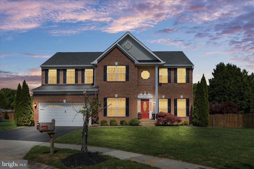 Welcome to this beautifully maintained brick-front Colonial in sought-after Canter Farms, perfectly positioned on a flat 0.34-acre cul-de-sac lot. Offering over 4,200 square feet of finished living space, this 4-bedroom, 4 full bath home combines timeless style with thoughtful updates and exceptional indoor-outdoor living. Inside, the open-concept layout is highlighted by a dramatic two-story great room with coffered ceiling, Juliet balcony, skylights, and a striking dual-sided stone gas fireplace. The gourmet eat-in kitchen flows seamlessly into the space and features maple cabinetry, granite countertops, stainless steel appliances (2023), a gas cooktop island, walk-in pantry, and a beverage center. A sunroom bump-out with vaulted ceilings, skylights, and its own heating and cooling provides a bright and functional extension of the main level off Kitchen and conveniently located to backyard oasis or the fabulous three-season room. The standout three-season room offers a decorative wood-paneled vaulted ceiling, skylights, and the second side of the stone fireplace, creating a warm, inviting space with direct access to the deck and backyard. Outdoor living shines with a Trex deck and pergola, extensive hardscaping, outdoor speakers, and a classic Grecian-style in-ground pool with diving board, all within a fenced yard designed for relaxing and entertaining.  Upstairs, the spacious primary suite features vaulted ceilings, a sitting area, a large walk-in closet, and a spa-inspired bath with jetted tub. Secondary bedrooms are generously sized with walk-in closets, and an upper-level laundry room with storage adds everyday convenience. The finished walk-up basement offers flexible living space, including a potential fifth bedroom, recreation area, and abundant storage. Additional highlights include a main-level office with French doors, formal living/music room and dining rooms with detailed molding, a two-car garage, and a whole-house generator. Recent updates include a 30-year architectural roof (2017), built-in furnace humidifier (2018), stainless steel kitchen appliances (2023), pool resurfacing and tile (2022), pool filter and pump (2021), basement carpet and paint (2025), main-level full bath updates toilet/sink (2026), and interior paint (2021). With classic architectural details, versatile living spaces, and a backyard designed for making memories, this home offers the perfect blend of comfort and lifestyle. Conveniently located near shopping, dining, and major commuter routes including Fort Meade, NSA, MARC, DC, Baltimore, BWI, and Annapolis. Book your tour today!