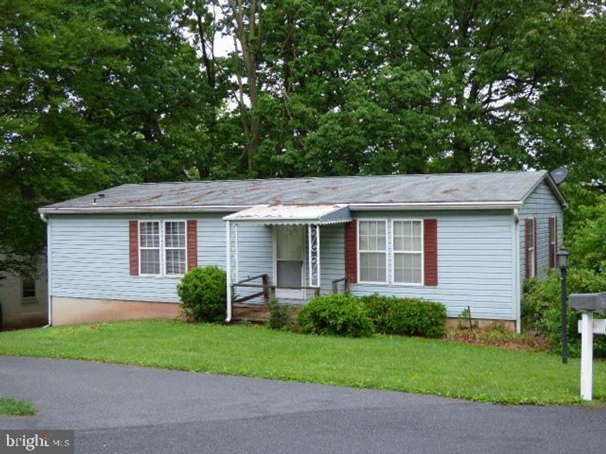 Build sweat-equity in this unique property. Featuring a spacious 2 bedroom, 2 full bath doublewide mobile home sitting on a full basement plus a one car garage. All situated on a .19 acre lot that is OWNED! 55+ community and the HOA included; snow, mow, water, sewer and trash.