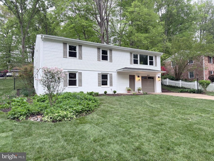 This stunning 4-bedroom, 3-full-bath  home in West Springfield has been renovated from top to bottom! This lovely home sits on a fully fenced quarter-acre lot has been completely reimagined inside and out — new roof, new siding, new windows, new exterior doors, new hardwood floors, new kitchen and new bathrooms. A designer helped plan the layout and finishes, and it shows! Walk in to an open main level where the kitchen, living room, and dining area flow together. The kitchen was rebuilt with quartz counters and a quartz backsplash, a center island, gas cooking, stainless steel appliances, pendant and recessed lighting, and new cabinetry. The kitchen opens to the  living room with recessed lighting and hardwood floors and the dining area sits just off the kitchen with easy access to a screened porch overlooking the backyard. The primary suite has been significantly enlarged and the walk -in closet is dreamy. The primary bath was expanded to include a walk-in shower, a new vanity, tile floors, and a private enclosed toilet room — a real upgrade over what these homes typically offer. A second bedroom and a fully updated hall bath with a tub/shower combo, new vanity, new tiling, and a skylight round out the upper level. The lower level adds two more bedrooms, a large family room with a wood-burning fireplace which has been re-stoned with new mantel, and a third full bath featuring an oversized roll-in shower with new tile and vanity. Hallways on this level are wider and all doorways are 32" inches for wheelchair accessibility — a thoughtful detail whether you need it now or want to plan ahead. New luxury vinyl plank flooring runs throughout the lower level. A brand-new laundry room on the lower level includes cabinetry, a sink, and a folding table. Outside, mature trees were removed to open up the lot, and a new back patio and landscaping were added. The fully fenced yard gives you privacy on all sides. The attached one-car garage has a 50-amp, 240-volt circuit already wired for an EV charger. Rolling Valley has no HOA and has a community pool if you are interested. The location is close to the Fairfax County Parkway, with commuter lots, direct bus to the Pentagon and the VRE within a few miles.  This home is in popular West Springfield High School pyramid. If you are looking for a fully remodeled home, this is a home you do not want to miss!
