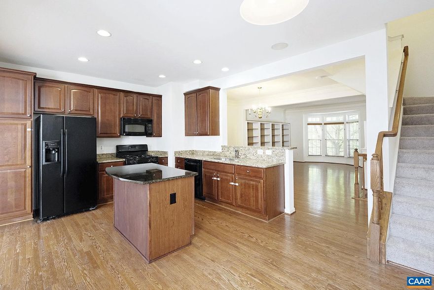 Move-in Ready! This pet-friendly 4 bedroom, 3.5 bath townhome is nestled in the Cherry Hill community, offering the perfect blend of convenience and comfort. Just minutes from the University of Virginia, UVA Medical Center, and downtown Charlottesville. Enjoy the convenience of being near shopping, dining, and entertainment! The community is an easy walk to Tall Oaks (Johnson) Elementary and a short drive from 5th Street Station and I-64.  Inside, discover three finished levels featuring a blend of hardwood, carpet and vinyl flooring, plus high ceilings. The main living level features an open living and dining area that flows into the eat-in kitchen with granite countertops and black appliances. A sunroom and a half bath complete this level. Upstairs, the primary bedroom includes a vaulted ceiling, walk-in closet, and private bath, while two additional bedrooms share a hall bath. The walk-out ground level consists of a large family room with an adjoining kitchenette, a 4th bedroom or home office option, a full bath, and an unfinished laundry area (washer and dryer included). Unwind on the rear deck, and enjoy the fenced patio that connects to the detached rear-entry 2-car garage.