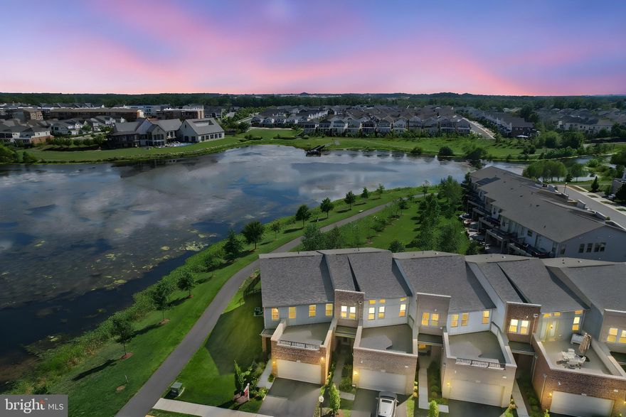 THIS IS A 55+ COMMUNITY ***WOW!!! You will not want to miss this end-unit home situated on a premium lakefront lot in amenity-filled Birchwood! The unique exterior features a fenced-in backyard oasis with a stone patio and a spectacular view of the lake, along with a convenient separate gas line. The sprinkler system services the spacious, low-maintenance yard.  You will not find another lot like this!

The open floor plan features high ceilings, two-piece crown molding, an abundance of natural light streaming through plantation-shuttered windows, and recessed lighting. The heart of the home is the chef’s kitchen, complete with stainless steel appliances, soft-close cabinetry, granite countertops with a backsplash, a grand center island with pendant lighting, and a huge walk-in pantry with built-in shelves. The family room features a gas fireplace and overlooks the lake. Main level also includes a private office with a built-in desk, a powder room, additional storage, a utility sink, and a 2-car garage. 

Upstairs is the owner’s suite which boasts a trey ceiling, a walk-in closet with custom shelving, and an en suite bathroom with upgraded tile, double granite-topped vanities, an extra-long 6ft soaking tub, and a separate frameless shower. This bedroom opens to a large upper deck with a stunning view of Birchwood Lake, complete with an added hose bib for easy gardening.

Two additional generously sized bedrooms are located upstairs, sharing a full bathroom with granite double sinks and a tub/shower combo. All bedrooms feature ceiling fans. Upstairs, there is also a loft area that can be used as a second office or media space. The laundry room, conveniently located on the bedroom level, includes a laundry sink and additional cabinetry for storage.

Birchwood offers phenomenal amenities to enjoy! A magnificent clubhouse, indoor and outdoor pools, a demonstration kitchen, theater and game rooms, a health and wellness room, an art studio, a golf simulator, social gathering areas, indoor and outdoor bars, biking and walking trails galore, pickleball and bocce ball courts, a greenhouse and garden area, and a fishing pier with public access (catch and release only). The HOA monthly fee includes high-speed internet and a TV package.

Located in the heart of Loudoun County, with easy access to primary commuter routes including Loudoun County Parkway, Route 50, the Dulles Greenway, and Dulles Toll Road. Dulles International Airport is just 4 miles away, and to the west, you'll find the Blue Ridge Mountains, historic Middleburg, wineries, and craft breweries.