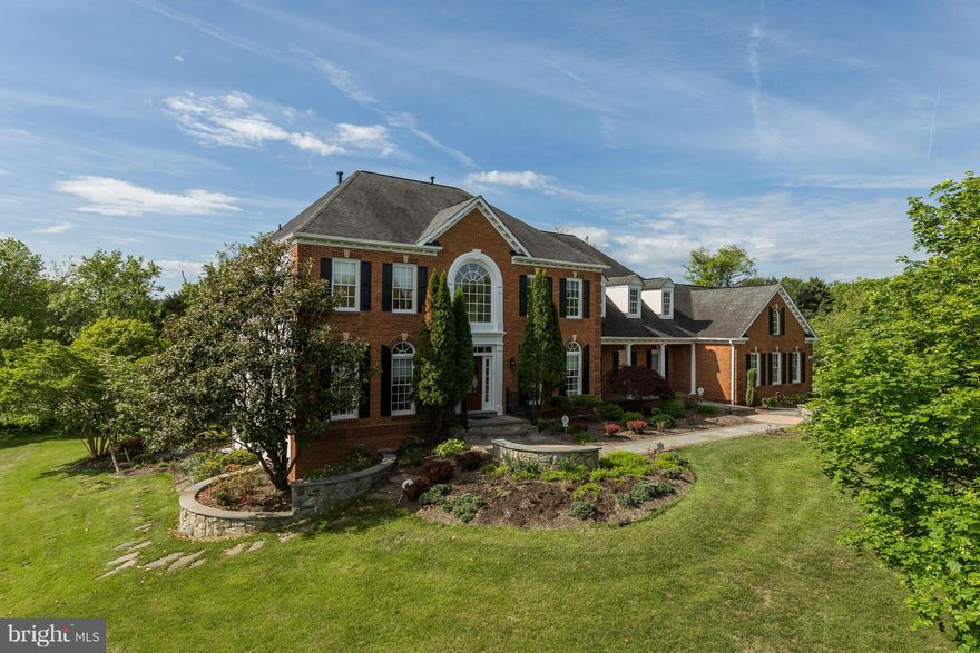 Private NV home estate surrounded by 3 sides of scenic open space! Gourm kit w/high-end appls, granite, maple cabs & lavish backsplash.  Family Rm w/ Gas FP & Access To Deck. Lrg lux Master Suite w/sitting rm, walk-in & lux bath plus generously sized Bdrms. Fin LL features tons of entertaining space plus walk-out to beautiful level lot w/slate patio. Hurry!