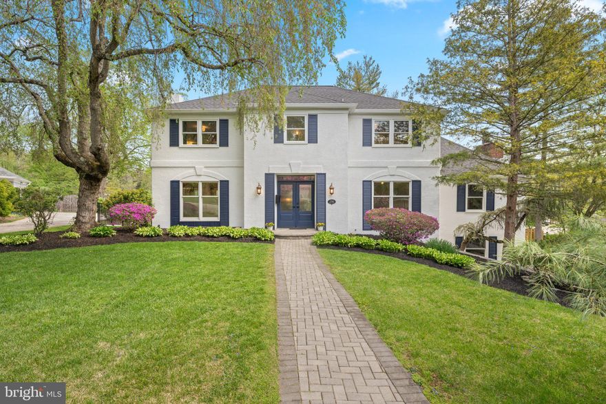 Located on a quiet, U-shaped street with immediate access to the Indian Creek walking trail, this Elegant French Colonial offers an ideal balance of neighborhood connection and private serenity. The residence boasts outstanding curb appeal, framed by perfectly curated landscaping with multiple specimen plantings. Newer double front doors (2021) open into a bright foyer where a striking open-concept staircase and custom millwork throughout establish an immediate sense of quality.
The home’s architectural design and thoughtful decorator choices—including arched doorways, neutral grasscloth and ethereal silk wallcoverings, serene paint colors,—create a peaceful, harmonious environment. This tranquil interior serves as the perfect backdrop to connect with nature via expansive windows that frame the surrounding greenery.
To the left, the front-to-back living room features custom built-ins that effortlessly function as a butler’s pantry—ideal for hosting—with large, fixed windows overlooking the recently renovated pool. To the right, the spacious dining room serves as a refined venue for formal gatherings.
The true heart of the home is the designer eat-in kitchen. Upon entering, you are instantly captivated by a wall of oversized windows that drench the kitchen and breakfast room in radiant light. This gourmet space is appointed with solid wood cabinets, quartz countertops, and a premium appliance package. Exquisite custom millwork is integrated into the surrounding built-ins, designed to marry form and function by providing additional storage solutions without compromising the room’s clean lines.
From the kitchen sink, enjoy spectacular views of the rear yard and the lush natural habitat of Indian Creek. Just off the breakfast area, a concealed door reveals an oversized laundry room equipped with a utility sink and a fold-down folding table. This level is completed by a front-to-back family room featuring a vaulted ceiling and sliding doors that showcase the views to the outdoors.
The second floor hosts a primary suite designed as a cozy retreat, complete with custom built-ins, a walk-in closet, and a large-footprint bathroom with a double vanity. Three additional well-sized bedrooms share a modern hall bath featuring a curbless shower with a frameless glass enclosure. For additional living space, the lower level is fully finished and recently waterproofed (2025), making it a perfect spot for a home office or recreation room.
With major systems recently updated—including the roof (2024), HVAC (2018), many windows (2025), and a replastered pool with new coping (2026)—and located just an easy stroll from Penn Wynne Park and Penn Wynne Elementary, this home is a rare, turn-key opportunity in a stellar location.