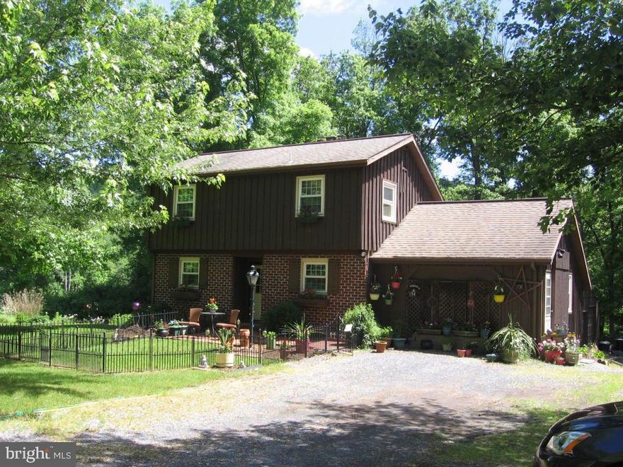1.4 acre semi wooded lot with frontage on Hammer Creek. Living room features a vaulted ceiling with skylights, brick fireplace with insert and a great view. Master bedrooms on 1st and 2nd floors, replacement windows and lots of privacy. HSA warranty included.