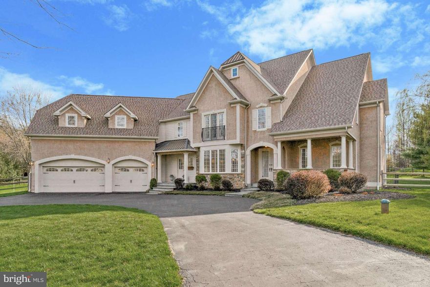 Welcome to this French country home with European elegance nestled in New Hope, PA. Attention to detail truly resonates throughout the home. From the finely crafted archways, custom moldings & high ceilings, the home consistently delivers on the highest architectural standards at every turn. Exceptionally maintained, the interior is designed with an open floor plan creating a spacious & airy atmosphere for day-to-day lifestyles as well as entertaining. First floor offers a 2-story gathering room with a centerpiece floor-to-ceiling stone pattern fireplace (propane). Kitchen boasts custom raised panel cabinetry, granite tops, Sub-Zero fridge, 6-burner Wolf stove & more. Sunroom is accessed via double wide barrel doorways, vaulted ceiling & walls of windows. Off the sunroom is a sliding door to the grand deck to enjoy the scenic backyard with an expansive tree farm beyond the property line. A spacious formal dining room includes a bay window with keystone accented arched doorways. Home office with french doors, a flex room, half bath, laundry room, mud room & 3 car garage complete the first floor. The 2nd floor offers 4 bedrooms including a lavish primary suite with a dressing area that includes a large walk-in closet & three spacious closets connecting the bedroom with the spa-like bathroom. The bathroom includes a french stand-alone soaking tub, two separate vanity areas, under-floor heating, luxurious shower & more. The three other bedrooms are generously sized & two include en suite baths. Finished walk-out basement includes a half bath, large open space for entertainment & two additional bonus rooms. Storage abounds with multiple large double door closets & additional storage & workout area in another section. The well-designed exterior is equally impressive & includes a U-shaped driveway, front covered porch & two entry points besides the 3 car garage. This remarkable home sits on one acre in the Quarry Valley community. This spacious home enjoys 5,461 finished square feet consisting of 4,357 above-grade finished square feet & 1,104 below-grade finished square feet. Charming Peddlers Village is in walking distance. Plus, all the river towns of New Hope, Lambertville & Washington Crossing are close by as well as the borough of Doylestown. Home is located in the well acclaimed Central Bucks School District and convenient to the necessities of New York City, Princeton, and Philadelphia.