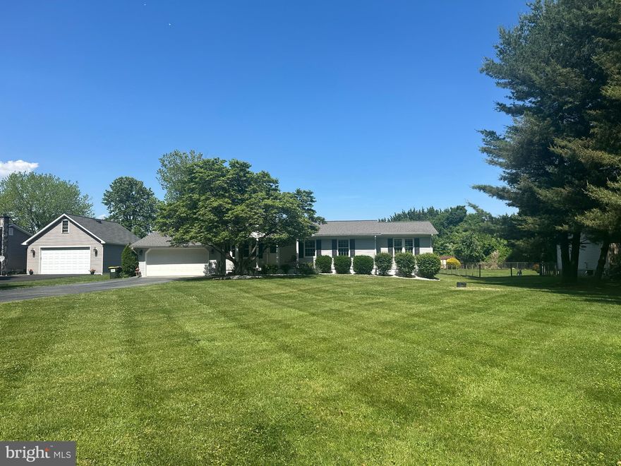 Beautiful 3-bedroom, 2 full bath rancher completely renovated in 2007 with numerous upgrades (hardwood flooring, ceramic tile and maple cabinets). New roof in 2018, new a/c system installed in 2026. New carpet and paint throughout. No town taxes. Town septic, well with water conditioner. Covered front porch, beautiful patio with fire pit and bench seating, trex deck with vinyl railings off of family room and kitchen. Central vacuum, huge primary bedroom with master bath and walk-in closet. Two sheds with electric and beautiful landscaped lot.