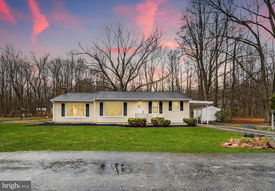 Welcome home to this beautifully updated rambler in the heart of Churchton! This 3-bedroom, 2 full bath house has been thoughtfully modernized, featuring a traditional floor plan with stunning hardwood floors and fresh updates throughout. Brand new kitchen with upgraded cabinetry, elegant backsplash, and modern quartz countertops. Enjoy cozy evenings by the brick fireplace with a wood stove insert or host summer gatherings on your spacious 0.35-acre lot. Conveniently located just minutes from the Chesapeake Bay and local favorites, this home offers the perfect blend of coastal living and modern comfort.