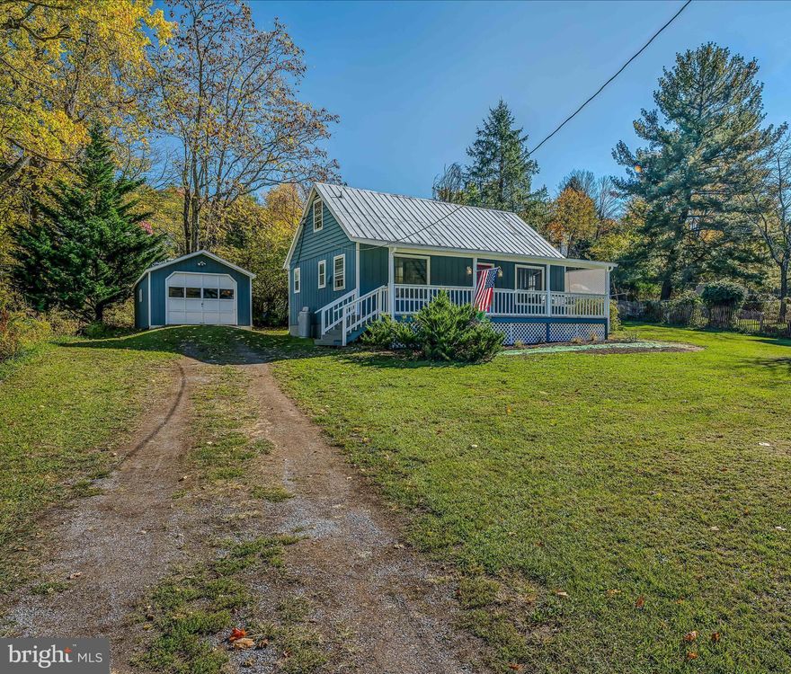 Experience the comfort and luxury in this tastefully renovated cottage, boasting a new addition that enhances the main floor bedroom and attaches a brand new full bath. Fresh paint, both inside and out, complement new flooring, a second full bath, laundry room, and kitchen cabinets that have been given a fresh coat of paint. An open and airy great room with vaulted ceiling PLUS sleeping loft (2nd BR) with wooden floor create the perfect space for relaxation. Step outside and unwind on the charming front porch or make use of the detached garage. All of this is located just a short distance from downtown Berkeley Springs, where you can indulge in local shopping, dining, and spas.