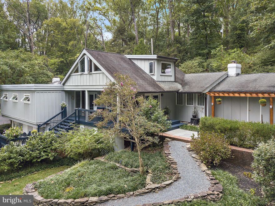 ** This sale includes 2 parcels of land for a total of 2.76 acres.  Each parcel has a separate Tax ID number -Parcel #1: 04090800748 and 2.04 acres & parcel #2:  908007482 and .72 acres.   Zoning is  DR2.  Reference uploaded documents for more information**

Sprawling  contemporary style  home tucked away  on a private oasis of mature trees, lush gardens and landscaping make this home a 'standout'.  Truly a spectacular and tranquil setting in a sought after Ruxton location.   Generously sized rooms with an open concept floor plan offer comfortable living and entertaining space.  A plethora of expansive windows allow for an abundance of natural light and  eye-catching views of nature and wildlife.   This move-in ready home showcases unique contemporary features  including dramatic vaulted ceilings, brick and hardwood flooring, floating cabinetry, & private courtyards.  The location of the 3 main level bedrooms with en suite baths offer an element of privacy as they are tucked  away from the main living quarters.   The upper level boasts a large versatile room with eye catching roof lines and loads of windows.  It offers great opportunity to be a playroom,  4th bedroom, office, or work-out area.   Outdoor living spaces abound offering endless relaxation and entertainment opportunities -  patios, decks, walking and trail paths, covered porches, and firepit area... The expanded circular driveway and  parking areas coupled with a 2 car attached garage provide plenty of parking options.