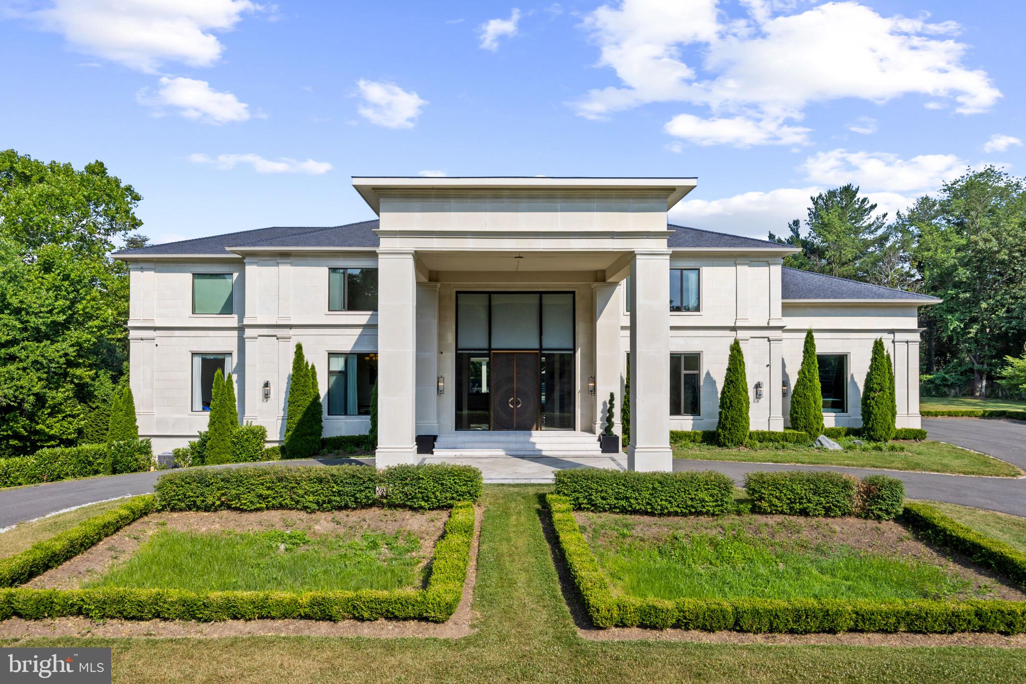 Presenting 8880 Bradley Blvd, an exquisite oasis nestled in one of the nation's wealthiest neighborhoods. This captivating residence integrates one-of-a-kind modern architecture, top-of-the-line building elements, and cutting-edge smart home technology. Spanning a 2-acre fully gated estate, it encompasses a 13,750-square-foot living space that boasts 7 bedrooms, 7 full bathrooms, and 2 half bathrooms across three levels, all served by a custom hydraulic elevator - a rare find among newer constructions of this stature.
Start your luxury experience by driving through the stately app-controlled arch top iron gate. An ascending scenic driveway leads you to a magnificent front entrance featuring a circular driveway, picturesque landscaping, and a custom-designed Italian bronze front door. The foyer, with its 24-foot-high ceilings and a breathtaking custom-made light sculpture designed by Cameron Design in London, creates an unforgettable first impression. The main kitchen is a culinary dream, featuring commercial-grade, top-of-the-line appliances. A scullery kitchen with a separate entrance offers great convenience for everyday cooking and entertainment needs.
The lower level is designed for ultimate relaxation and entertainment. It features a Turkish bath with separate warm room, steam room, and heated marble surfaces, a fully equipped gym, a state-of-the-art movie theater, a wine and cigar room, and a kitchenette with full size refrigerator, dishwasher and microwave. The same level of opulence is reflected in all the bedrooms on the upper level, especially the owner's suite, which boasts a spa-like master bathroom with heated floors, a two-room dressing area, and a serene sitting room with a morning bar. A four-car attached garage includes a Porsche charging station, a basketball hoop, and air-conditioning. State-of-the-art windows equipped with remote-controlled custom window treatments and blinds throughout the entire residence are designed to bring breathtaking outdoor views indoors, providing tranquility and unparalleled comfort to everyday life.
Step outside to discover an outdoor relaxation and entertainment haven with a saltwater pool framed by 4 gas fire pits, an infinity edge and a mosaic-tiled jacuzzi. A dedicated full bathroom and a cabana equipped with a full outdoor kitchen, a fireplace, and ample seating areas elevate your luxury experience to the next level.
Beyond the eye-popping features, the attention to detail extends to infrastructure such as whole-house soundproofing and insulation, a central vacuum system, an app-controlled surround sound system, an advanced security system, commercial-grade HVAC, hot water tanks, and a generator to provide peace of mind for any situation.
Located less than half an hour from the nation’s capital and only minutes from several PGA golf courses, top-rated private and public schools, upscale shopping, and fine dining, this property is yet very private and surrounded by lush trees, offering the perfect blend of convenience and tranquility. From its top-tier quality to its unique design, this extraordinary estate is a testament to quiet luxury and modern lifestyle.
