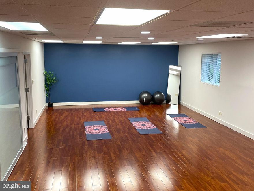 Suite 108 – Serene, Functional Space Ideal for a Yoga or Wellness Studio
Thoughtfully designed to support a calming and client-friendly experience, Suite 108 offers an open, versatile layout ideal for group classes, private sessions, or holistic services. Guests are welcomed by a reception area at the front entrance, creating a warm and professional first impression.

The suite includes two private offices adjacent to the main studio area—perfect for consultations, massage therapy, or staff use—as well as a dedicated storage room at the rear for equipment or supplies.

Private restroom access adds to the convenience and comfort of both clients and staff. With its flexible floor plan and inviting atmosphere, Suite 108 provides an excellent foundation for a wellness-focused business.
Prime Location with Exceptional Accessibility
Ideally situated within walking distance of the vibrant Rockville Courthouse district, this office space offers convenient access to a wide range of services and amenities. Tenants and their clients will appreciate ample on-site parking, ensuring hassle-free arrivals and departures.

Just 0.2 miles from Rockville Metro and 0.3 miles from Rockville Town Center, the location provides seamless connectivity and access to shopping, dining, and entertainment options. Positioned just off Route 355, this space combines visibility with easy commuter access, making it an ideal choice for growing businesses.