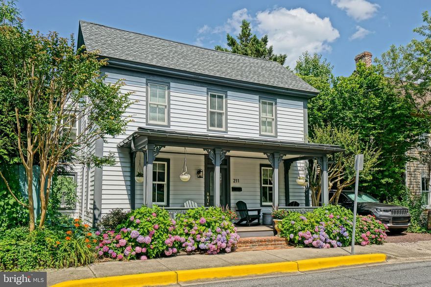 MODERN MASTERPIECE IN HISTORIC LEWES! Experience the perfect harmony of 19th-century charm, and sleek, contemporary luxury. Located in the very heart of Lewes, this stunningly renovated historic home offers a rare "best of both worlds" lifestyle just steps from iconic downtown shops and a short breeze away from the beach. Home delivers a sophisticated coastal lifestyle across 5 bedrooms and 4 luxury baths. The layout is thoughtfully designed for effortless living, featuring both first and second-floor owner’s suites and expansive, sun-drenched gathering spaces. At the center of it all is a gourmet kitchen that serves as the home's crowning jewel, fully remodeled with sparkling new appliances, elegant stone countertops, a double wall oven, and designer cabinetry.

The seamless flow continues into the formal dining area, highlighted by industrial-chic lighting, and a cozy family room centered around a crisp white fireplace and custom built-ins. Throughout the home, spa-like bathrooms feature massive glass-enclosed showers and contemporary vanities that provide a high-end retreat for guests and owners alike. This private sanctuary extends to the outdoors, where you can enjoy a massive screened porch and a fully fenced yard complete with a relaxing hot tub and a historic outbuilding. Rare off-street parking in the center of town completes this exceptional package, allowing you to enjoy the very best of Historic Lewes and the beach! Call Today!