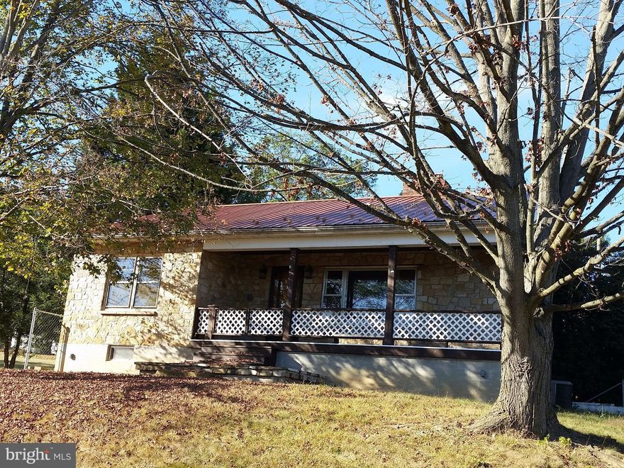 This gem is waiting for your finishing touches.  Sitting on about two thirds of an acre this two - three bedroom has a recent metal roof, a tankless water system, and a furnace installed in 2011.  It has a carport and off street parking for at least five cars with room to breathe on the 3 extra lots.  Build your equity with this home. It is an estate and is being sold "as is"  but has great bones!