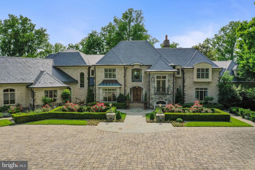 This extraordinary gated 20-acre waterfront estate, featuring a French-inspired stone residence, sits prominently along the banks of the Severn River just minutes from downtown Annapolis and under an hour from Washington, DC. With coveted western exposure, the property offers breathtaking, year-round sunsets and over 23,000 square feet of combined living space across the main house, guest house, and carriage house—all set amid rolling lawns, formal gardens, mature trees, and natural surroundings.

The main residence is designed for both grand entertaining and comfortable living, with ten sets of French doors opening to terraces and gardens. A dramatic two-story foyer with limestone and marble inlays leads to a soaring great room anchored by an 18th-century French carved limestone mantel. Additional main-level spaces include a formal dining room, library, and music room—each with its own fireplace—and a gourmet kitchen featuring dual marble-topped islands.

Upstairs, an open gallery overlooks the great room and grounds, while the expansive primary suite offers a fireplace, private sitting room, and waterside balcony with sweeping river views. The lower level is equally impressive, with a family room, billiards room and bar, a striking stone wine cellar with tasting room, media room, full gym with bath and sauna, and an additional bedroom suite. A separate wing provides a dedicated art studio or craft space, complemented by a motor court and two three-car garages.

Outdoor living is equally refined, with manicured lawns and gardens, an expansive patio, outdoor kitchen, hot tub, and charming details including a gardening shed, chicken coop, and raised beds.

The approximately 6,000-square-foot guest house is ideal for hosting, centered around a pool with a covered veranda, outdoor fireplace, bar, and gazebo—all with water views. Inside, it offers spacious living and dining areas with a shared stone fireplace, three bedrooms, two full and two half baths, and a full catering kitchen with Viking appliances. A breezeway connects to the carriage house with an additional three-car garage.

The estate’s 900 feet of shoreline is complemented by a 350-foot deep-water pier (8–9' MLW) with four slips, including two accommodating 60-foot vessels, and two boat lifts—perfect for boating, sailing, and enjoying life on the Severn River and Chesapeake Bay.