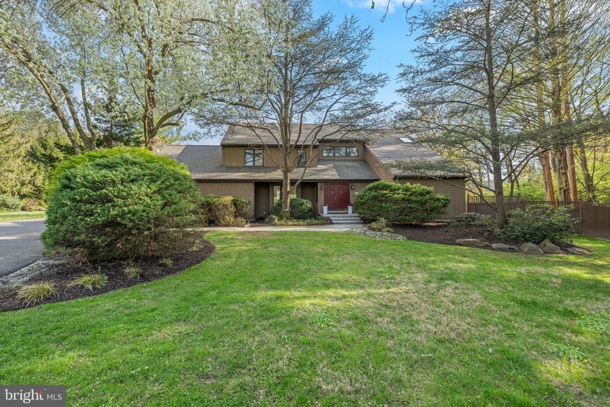 Rarely offered in this sought-after location, 57 Sugar Maple Drive is a beautifully designed property that effortlessly blends everyday comfort with exceptional versatility. Set on .77 acres, this 5-bedroom, 5-bath property features an in-ground pool, a finished lower level, a 3-car garage, and a fully separate guest house ( ADU )—ideal for extended family, returning college graduates, or a creative studio space. A set of double doors welcomes you into a gracious vestibule and airy two-story foyer. To the left, a sunlit dining room with a bay window sets the stage for memorable gatherings, while to the right, a sophisticated living room offers custom built-ins and a wet bar complete with wine and beverage refrigerators. Pocket doors lead to the inviting family room, where a stone fireplace anchors the space and sliding doors open seamlessly to the outdoor entertaining area. The kitchen is both functional and bright, featuring stainless steel appliances, light cabinetry, granite countertops, and an adjoining breakfast room perfect for casual dining. A dedicated home office with direct deck access provides a quiet and inspiring work-from-home environment. Thoughtful details like two conveniently located powder rooms and a well-designed mudroom enhance daily living. Upstairs, the primary suite is a true retreat, offering a spacious bedroom, three closets, and a spa-like bath with a frameless glass shower, double vanity, and freestanding soaking tub. Three additional generously sized bedrooms, a hall bath with tub/shower combo, and a convenient second-floor laundry area complete this level. The finished lower level with newer flooring adds valuable flexible space—perfect for a media room, playroom, or relaxed gathering area. One of the property’s most compelling features is the fully detached guest house. With its own private entrance, this one-bedroom residence includes a recently renovated kitchen, dining area, living room, full bath, and in-unit laundry. A private deck overlooks the pool, creating a serene and independent living space for guests or extended stays. Outdoors, enjoy resort-style living with a built-in grill, expansive patio, and lush grounds, including a large side yard. Ideally located just minutes from Episcopal Academy, Notre Dame, and Marple Newtown schools, as well as Whole Foods, Ellis Preserve, and the Paoli train station for easy access to Philadelphia.