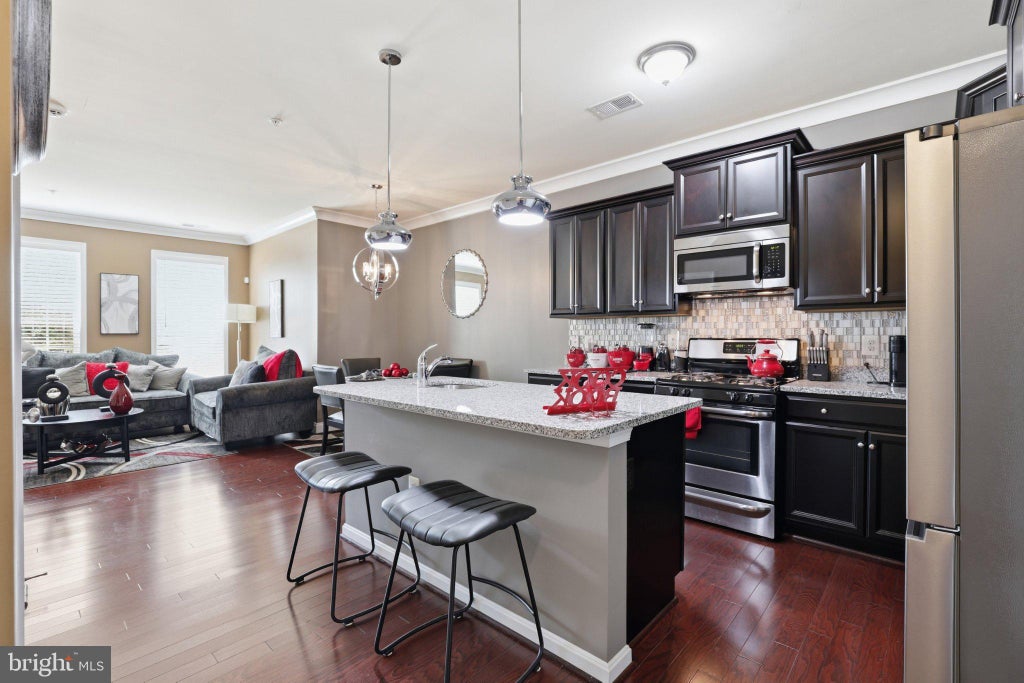Photo of 9106 Ruby Lockhart Boulevard #4, LANHAM, MD 20706 (MLS # MDPG2220752)