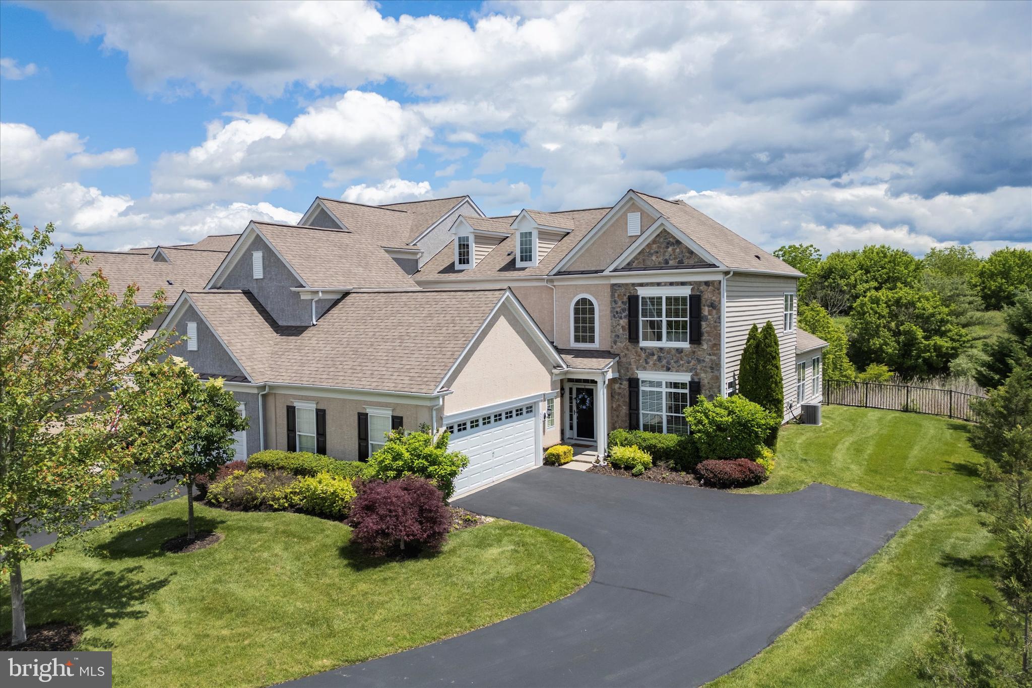 COMING SOON!! PRIVATE & PRISTINE End Unit Carriage House at the sought after "Reserve at Gwynedd"! Located in a Premium Cul-de-sac in a Private Setting! Sit on the Patio or in the Sun Room and watch Nature behind the house - colorful birds, deer and so much more. This Luxurious 55 community is tops in Montgomery County! 4 BR 2.5 bath spacious home with a 2-car attached garage has a long driveway entrance, which is a bonus as it allows for plenty of off street parking. Custom decorated professionally. This home has over $100,000.00 in builder & home owner upgrades/improvements! This includes upgraded lighting package, 42”kitchen cabinetry, morning room, lighting package and the entire home has upgraded custom wood millwork throughout! Rich hardwood flooring, 9 foot ceilings on first floor! Upon entering the elegant entry foyer is a beautiful sweeping circular staircase which leads to the 2nd fl. w/three spacious bedrooms, a full hall bath and a bonus loft. On the main floor is a formal dining room with architectural ceiling, chair rail, rich crown moldings. The FIRST FLOOR PRIMARY BEDROOM SUITE allows for easy living with architectural ceilings and a lavish bath with a double vanity, soaking tub, spacious shower area with customized spacious walk-in-closet! The upgraded gourmet kitchen, w/ large maple kitchen cabinets w/LED under cabinet lighting, granite countertops, stainless steel Kitchen Aid appliances with five-burner gas cook top, double wall oven, dishwasher and built in microwave. The breakfast area and the kitchen are open to the dramatic 2-story great room with a gas fireplace that is framed with large windows & lots of sunlight and scenic views. Best of all, enjoy relaxing in the Bright & Sunny Morning Room with Cathedral ceiling off the breakfast area that leads to the huge(26'x14') custom concrete & brick patio & enjoy the stunning open nature vistas! This gated community includes and indoor pool and year round jacuzzi, sauna, outdoor pool, fitness center, billiard room, card room, irrigation system maintenance, including water, & more! Plus Full time activities director!!—Carefree living! Sorry but you will have to wait to see this home until June 14th but make your appointment today.