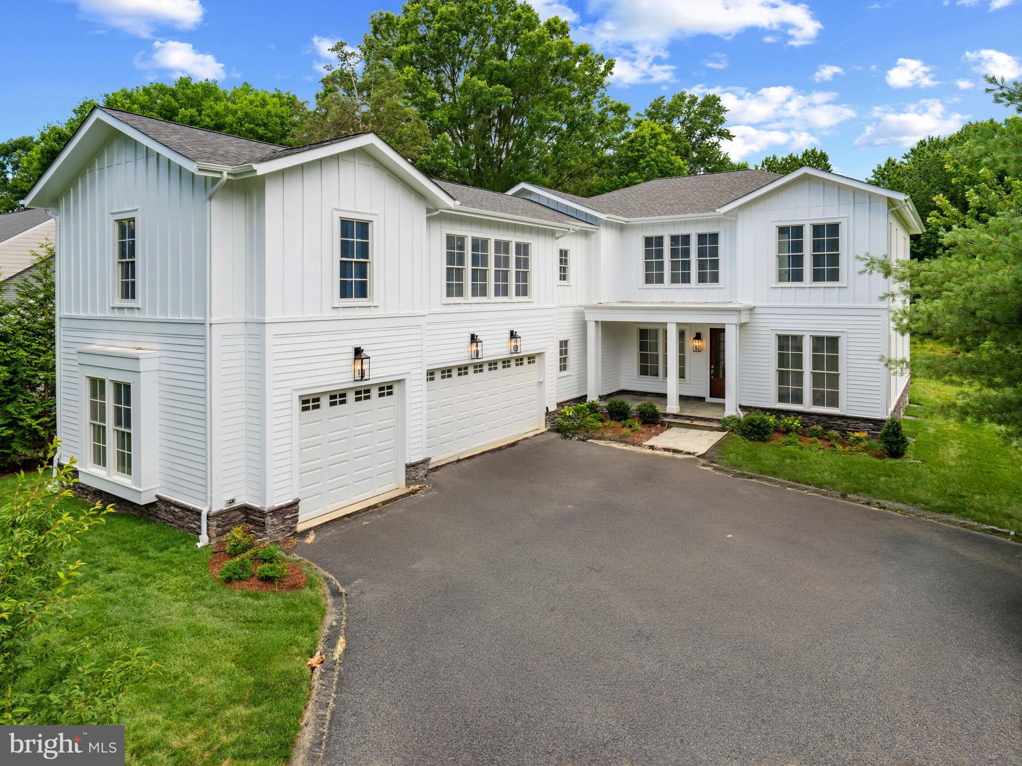 Unparalleled Craftsmanship & Elegant Design in Plymouth Haven. An Exceptional New Construction Crafted by Wakefield Homes & Designed by Kulinski Group Architects. Welcome to a spectacular custom residence offering over 6,700 finished square feet of refined living space across three meticulously finished levels, plus an additional 670 square feet of unfinished space, including a bonus room with rough-in for a full bath above the 3-car garage—perfect for future guest quarters or studio.
Set on a private, fenced half-acre lot next to open green space and a park, this architectural gem is located in the prestigious Plymouth Haven neighborhood, within the Waynewood Elementary School district.
This home boasts 6 spacious bedrooms, including a main-level bedroom/office with attached full bath, and 6 full and 3 half baths, with a rough-in for a 7th full bath in the unfinished FROG (Finished Room Over Garage).
Refined finishes and thoughtful design are evident throughout: St. Clair custom kitchen with inset cabinetry, MSI quartz countertops, GE Monogram appliances, Bridge faucets, custom wood hood, and statement designer lighting. Working pantry with butcher block counters and second full-size refrigerator, plus a separate butler’s pantry. 12-foot sliding doors open to the TimberTech Prime+ deck (14' x 18'), perfect for seamless indoor-outdoor entertaining. Elegant millwork including raised panel moldings, 4.5-inch casings, 9-inch baseboards, 9-inch cove crown moldings, and 8-foot solid core 2-panel doors. 7.5-inch wide-plank white oak flooring on main and upper levels, and wood flooring throughout upper level bedrooms. Two staircases with metal balusters, three pocket doors on the main level, and 10-foot ceilings on the main, 9-foot ceilings on upper and lower levels. Andersen 400 Series windows, Carrier 3-zone HVAC, Ecobee thermostats, and Therma-Tru Fiber-Classic Oak Collection front door. Home is elevator-ready with stacked closets on all levels and pre-installed conduit for future install.
The fully finished lower level includes a bedroom with en-suite bath, a gym with rubber flooring, an entertaining bar, a powder room, and MSI Everlife waterproof rigid core flooring, offering a space designed for relaxation and recreation.
Additional features of this home include include: Every bedroom has its own en-suite bath, Two water heaters (75-gallon gas + 50-gallon electric), Marble penny tile flooring in laundry room, Two 200-amp Leviton electrical panels, Kohler fixtures throughout, and Humidifier system for year-round comfort. This extraordinary home blends timeless craftsmanship with modern functionality in one of Alexandria’s most desirable communities.