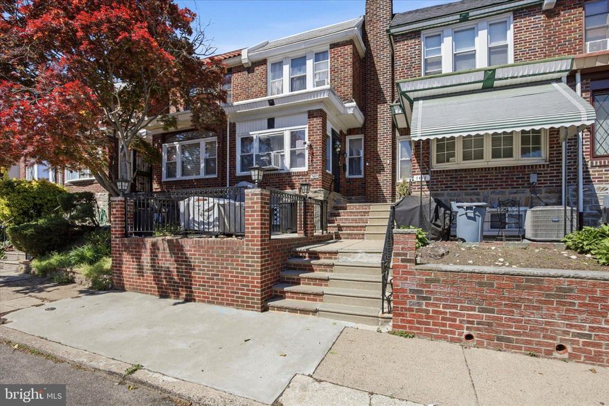 Welcome home to this meticulously maintained property in the West Oak Lane area of Philadelphia. Immediate curb appeal greets you from the custom front concrete patio perfect for entertaining any time of year. As you enter the house, you are greeted by a spacious full living area that opens up to the dining space. Bright windows bring natural light throughout this space. Past the dining area you will find the updated kitchen with tile flooring, quartz countertops, and stainless steel appliances, including a gas range. From the kitchen you may access the basement, a fully finished living area featuring a half bathroom, ample closet storage space, and the laundry area. There is a back entrance on this level out to the parking area that can fit up to one car off-street. The second level of the home features three spacious bedrooms and a modern full bathroom, with upgrades including a stall shower, soaking tub, and electric fireplace for comfort and relaxation. This property is move-in ready and has updated maintenance items such as a newly recoated flat roof (2025) and new hot water heater (2025.) Schedule your tour today and reach out for additional details!