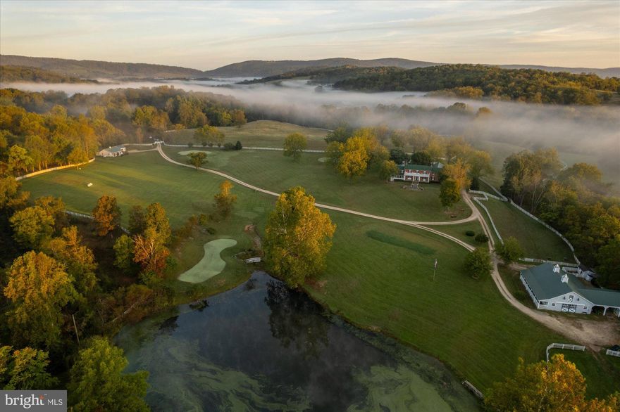 A storybook estate of timeless sophistication and country elegance. 

Located halfway between Upperville and Delaplane on the fringe of coveted Mellon land and Piedmont Hunt Country, Seaton Place Farm is set on 55+/- verdant acres of rolling lawns, mature trees, and wide-open pastures. The estate captures the beauty of every season — a true Currier & Ives setting.

The stately 5,800-square-foot 1840’s brick residence is perfectly sited amid stone courtyards, a koi pond, a graceful marble-and-wrought-iron rotunda, outdoor entertaining space with stone hearth, and in-ground pool. An expansive barn complex, additional private residence, large pond with dock, and a personal golf course compete the offering— all impeccably maintained.

Inside, the main house masterfully blends historic character with modern comfort. Exposed exterior brick walls, antique floors, vintage mantels and hand blown windowpanes are married with an expansive grand hallway, elegantly renovated baths and light filled, glass and window encompassed primary suite with private balcony and a bird’s eye vista of the grounds. The piece de resistance is the newly remodeled, published chef’s kitchen and great room wing, complete with an imported Lacanache stove, luxury appliances and custom cabinets balanced by a stone hearth and cathedral ceiling with exposed beams. The house has a total of four bedrooms, 3 full baths, 7 fireplaces, 2 car attached garage and views out of every window.

The charming carriage house adds a bright, open three-bedroom/2 bathroom private residence with full kitchen, multiple porches for entertaining, and detached garage. The carriage house is currently airbnb’d with all 5 star ratings, multiple re-visits and booked calendar.

The property has a Par 3 golf course with three professionally designed greens and 11 tee boxes. The greens and tee boxes use artificial turf for a low maintenance golf experience. 

The barn complex includes 6 stalls with individual walk outs, hot and cold wash stall, two tack rooms, ample storage above, and adjoining space for carriages, equipment, or a gym. There is a chicken “chalet” overlooking the creek for feathered friends, and fenced in barn designed for housing small ruminants. Cattle have been grazed on the lower pasture with creek access while horses enjoy the upper pastures with two run-in sheds. An additional chicken house and fenced garden with greenhouse and raised beds complete the gentleman’s farm.

This property lives like a world-class resort, offering endless recreation: horseback riding, golfing, fishing, hunting, kayaking, skeet shooting, swimming, sledding, carriage rides, or simply relaxing in an Adirondack chair with a view.

Every inch of this estate tells a story — one of beauty, heritage, and an extraordinary way of life.