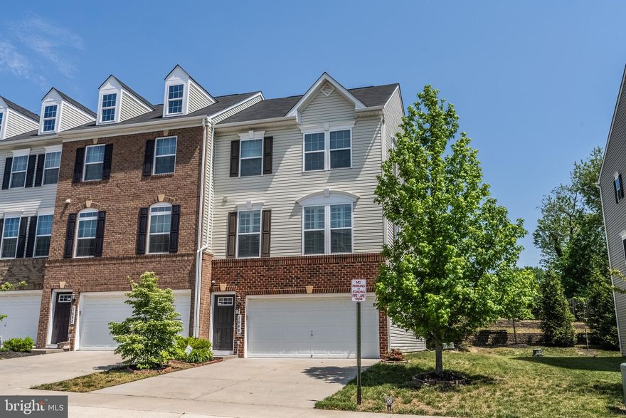 Beautiful End-Unit Townhouse built in 2016 in Featherstone Square with low HOA fee.  Nestled on a quiet residential street in the Featherstone Square neighborhood, this lovely end-unit townhome affords plenty of room for living with 3 bedrooms and 3.5 baths on 3 finished levels. A tailored brick and siding exterior, 2-car garage, spacious deck, warm and neutral paint, decorative moldings, plantation shutters, an abundance of windows, and a convenience in commute create instant move-in appeal. A welcoming foyer with hardwood flooring ushers you upstairs and into the bright and airy living room where windows on two walls stream natural light illuminating crisp crown molding, neutral paint, and plantation shutters. Hardwood floors flow seamlessly into the dining area which offers plenty of space for both formal and casual occasions. Here, a sliding glass door opens to the deck overlooking a tiered yard with common area beyond seamlessly blending indoor and outdoor entertaining or simple relaxation. Back inside, the gourmet kitchen stirs the senses with gleaming granite countertops, 42 inch cabinetry, recessed lighting, and stainless steel appliances including a smooth top range and built-in microwave. A large center island provides an additional working surface and bar-style seating, as the open atmosphere facilitates entertaining during meal preparation. The breakfast area harbors ample bistro table space and a built-in butler's pantry, while a powder room with pedestal sink rounds out the main level. Upstairs, the spacious owner's suite features plush carpet, a tray ceiling, walk-in closet, and en suite bath with a dual-sink vanity topped in granite, sumptuous soaking tub, glass-enclosed shower, and spa-toned tile with decorative inlay. Down the hall, two additional bright and cheerful bedrooms share access to the beautifully appointed hall bath and a bedroom level laundry room with utility sink eases the daily task. The walkout lower level recreation room with upgraded HDMI surround sound package provides plenty of space for games, media, exercise, as an additional full bath . All this can be found in a peaceful community with close proximity to I-95, Express Lanes, Route 1, and the Virginia Railway Express. Plenty of diverse shopping, dining, and entertainment choices are available just a short drive away at Potomac Mills Mall and Stonebridge at Potomac Town Center. Enjoy boating and fishing the miles of waterways at Powells Creek and the historic Potomac River. Washer and Dryer 2020