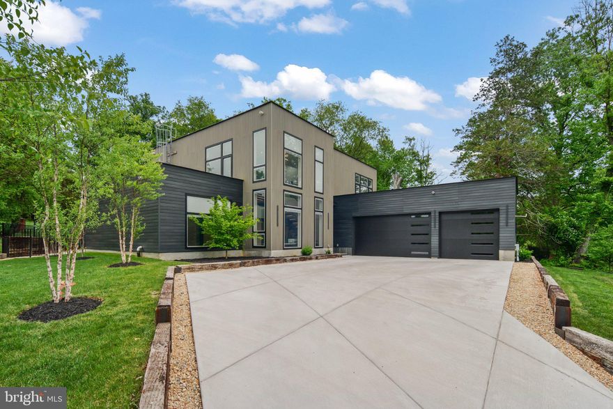 Custom-built in 2023 by a commercial builder with over 30 years of experience, this exceptional contemporary home in Pimmit Hills offers a rare combination of modern design, high-performance construction, and thoughtfully designed accessibility.
 
Set on a private 17,000 SF lot, the home features 5 bedrooms with en-suite baths, including a main-level primary suite with a spa-style bath and steam shower. Designed with ease of access in mind, the residence includes a 6-person glass elevator, wide hallways, and a main-level primary suite with a curbless steam shower.
 
Two fully equipped kitchens—including a dedicated prep kitchen—provide flexibility for everyday living and large-scale entertaining. Expansive indoor-outdoor spaces include a 300 SF ground-level patio and a 900 SF rooftop terrace, complemented by a 10-person swim spa with a dedicated bath.
 
High-end construction and systems include commercial-grade aluminum windows with integrated blinds, 3-zone rooftop HVAC with air sterilization, heated bathroom floors (in 4 of the bathrooms), tankless water heaters, whole-home audio/video wiring, and a 48kW whole-house generator.
 
Additional features include an Elfa finished, heated 3-car garage, and a fully enclosed steel-fenced yard with exterior lighting. Premium ADT security system with cameras and control panels already installed.
 
A rare opportunity to own a thoughtfully engineered, modern home combining luxury, durability, and long-term livability in one of Northern Virginia’s most convenient locations.