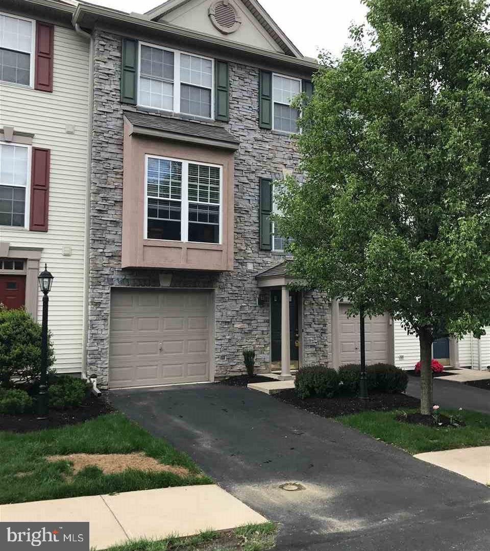 Gorgeous 3 BR Garage Townhome in Dallastown School District! Private Location backing to trees and open space. Beautifully decorated with crown molding and vaulted ceilings! Open Floor Plan, Upgraded Kitchen w/SS Appliances, Tile Backsplash, Deck off Main Level, Beautiful Finished Basement, 1 Car Attached Garage with Automatic Opener, Three large bedrooms, Lawn Care and Snow Removal Included! Owner is open to 1 year lease or longer and will offer a discount of $50/month for a 2 year lease or longer.
